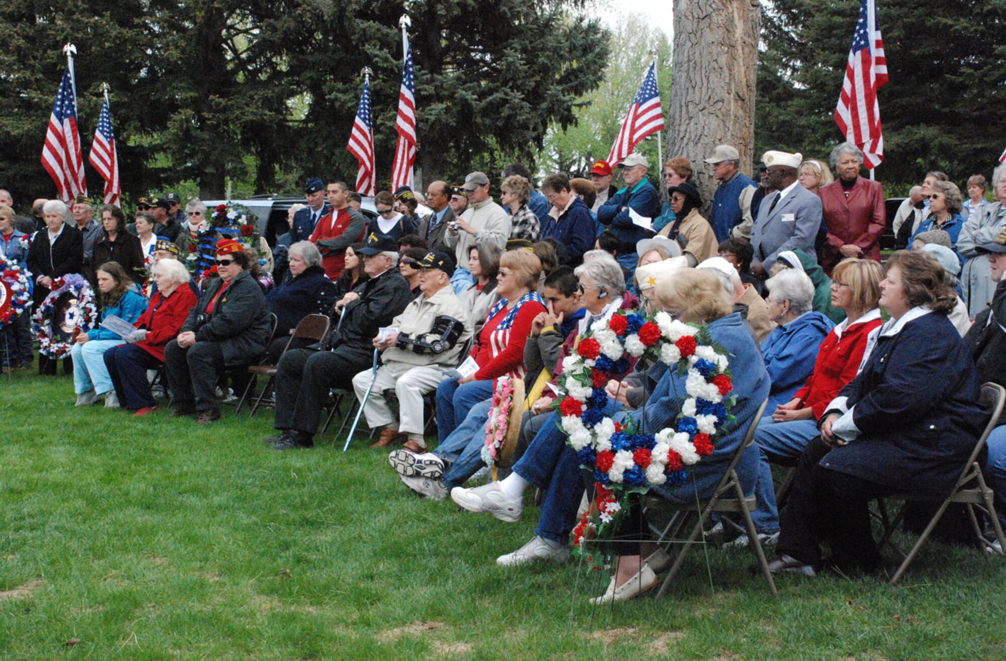 Attendees of the wreath-laying ceremony listen to a guest speaker at Beth El cemetery May 26. The three speakers were U.S. Senator John Barrasso, Wyoming Governor Dave Freudenthal and Harry Furrey, retired U.S. Navy (Photo by 2nd Lt. Lisa Meiman).