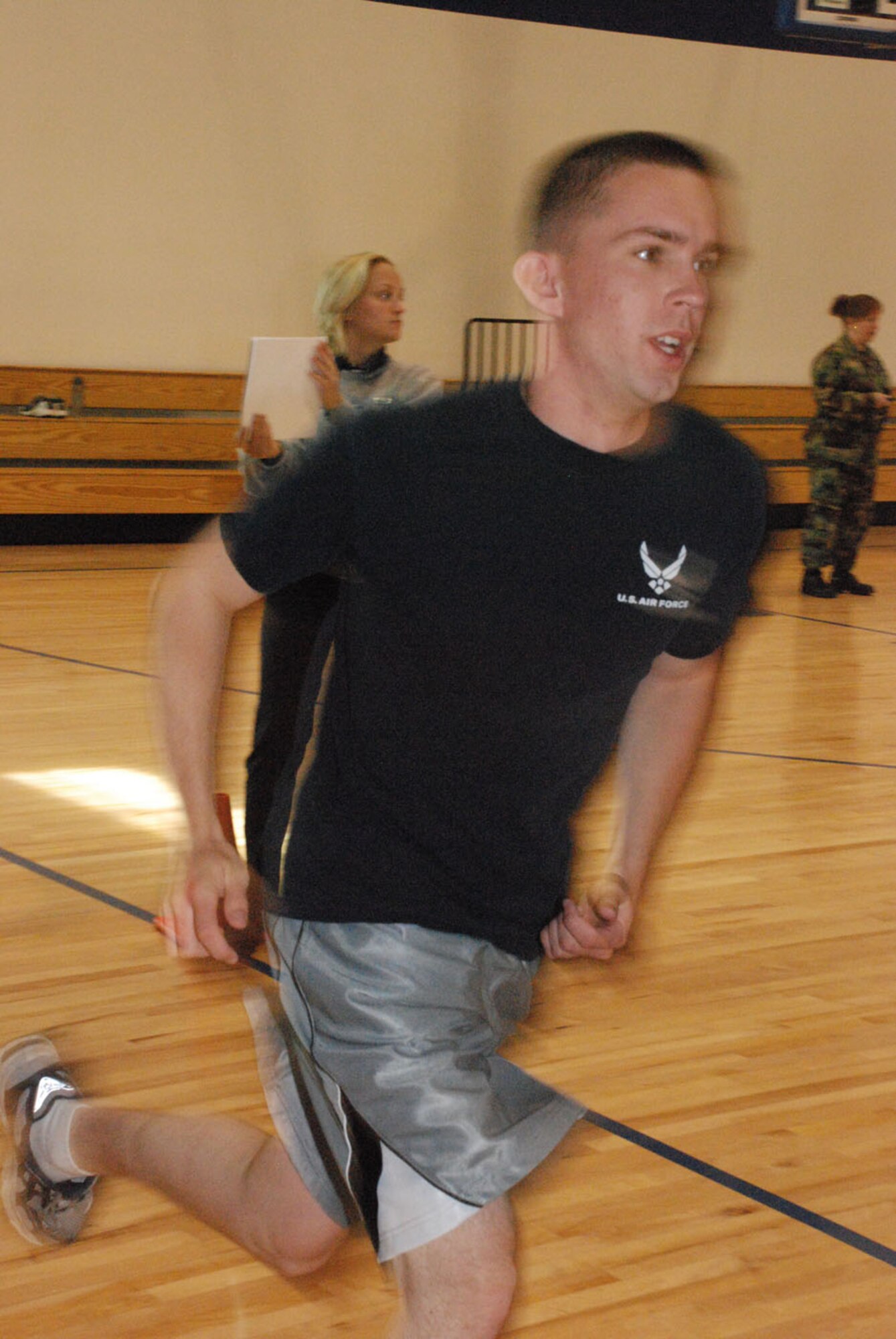 Airman Heath Goad, 90th Force Support Squadron, runs toward an answer during the May Fitness Month Jeopardy challenge.