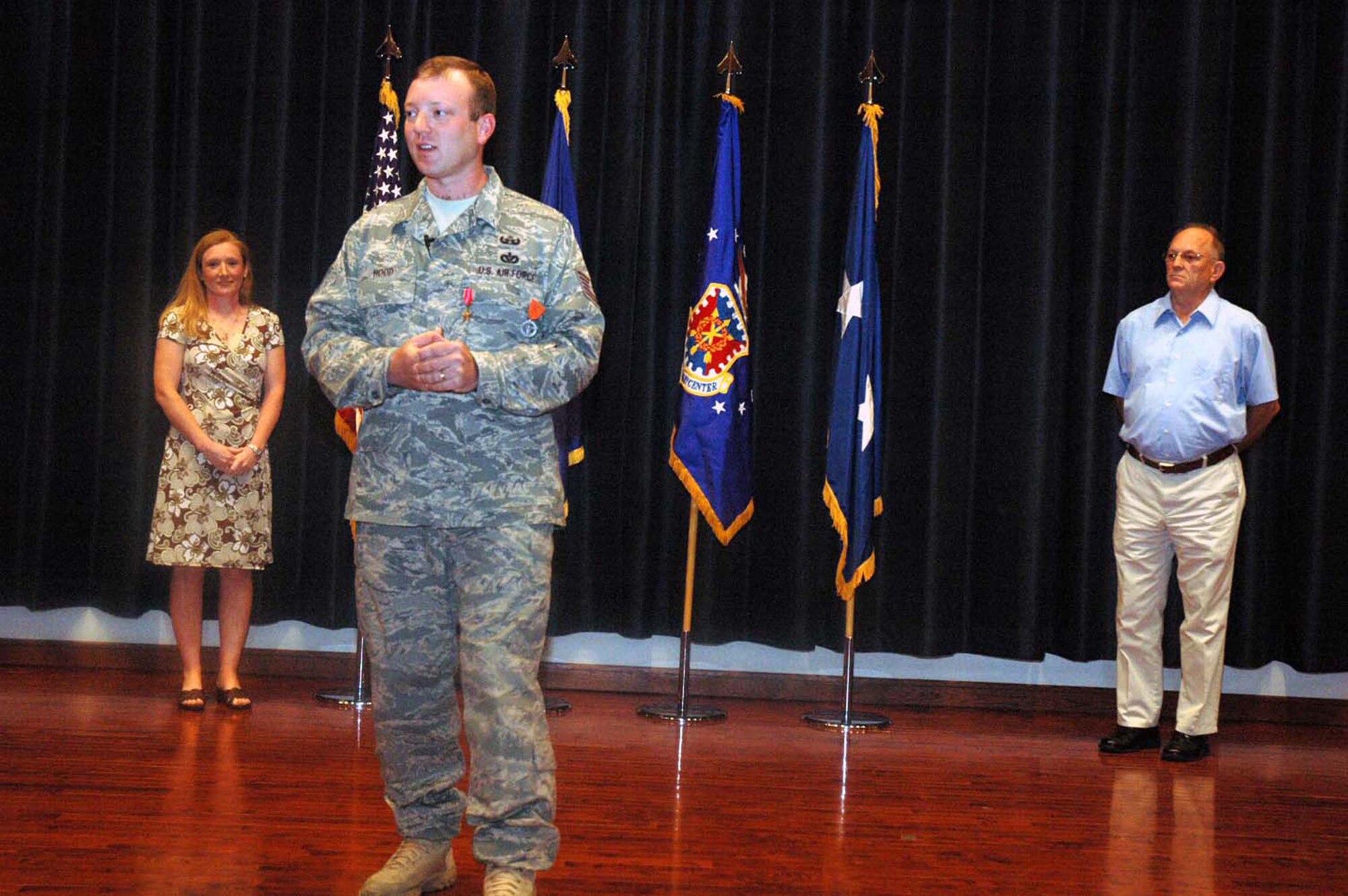 Tech. Sgt. Vandiver Hood, from the U.S. Air Force Expeditionary Center's 421st Combat Training Squadron, talks to the audience after receiving a second Bronze Star and Air Force Combat Action Medal in a special ceremony June 3, 2008, in the Center's Grace Peterson Hall at Fort Dix, N.J.  Sergeant Hood earned the medals for valor while deployed as part of an explosive ordnance disposal weapons intelligence team in Iraq.  He returned from that deployment in February.  (U.S. Air Force Photo/Tech. Sgt. Scott T. Sturkol)