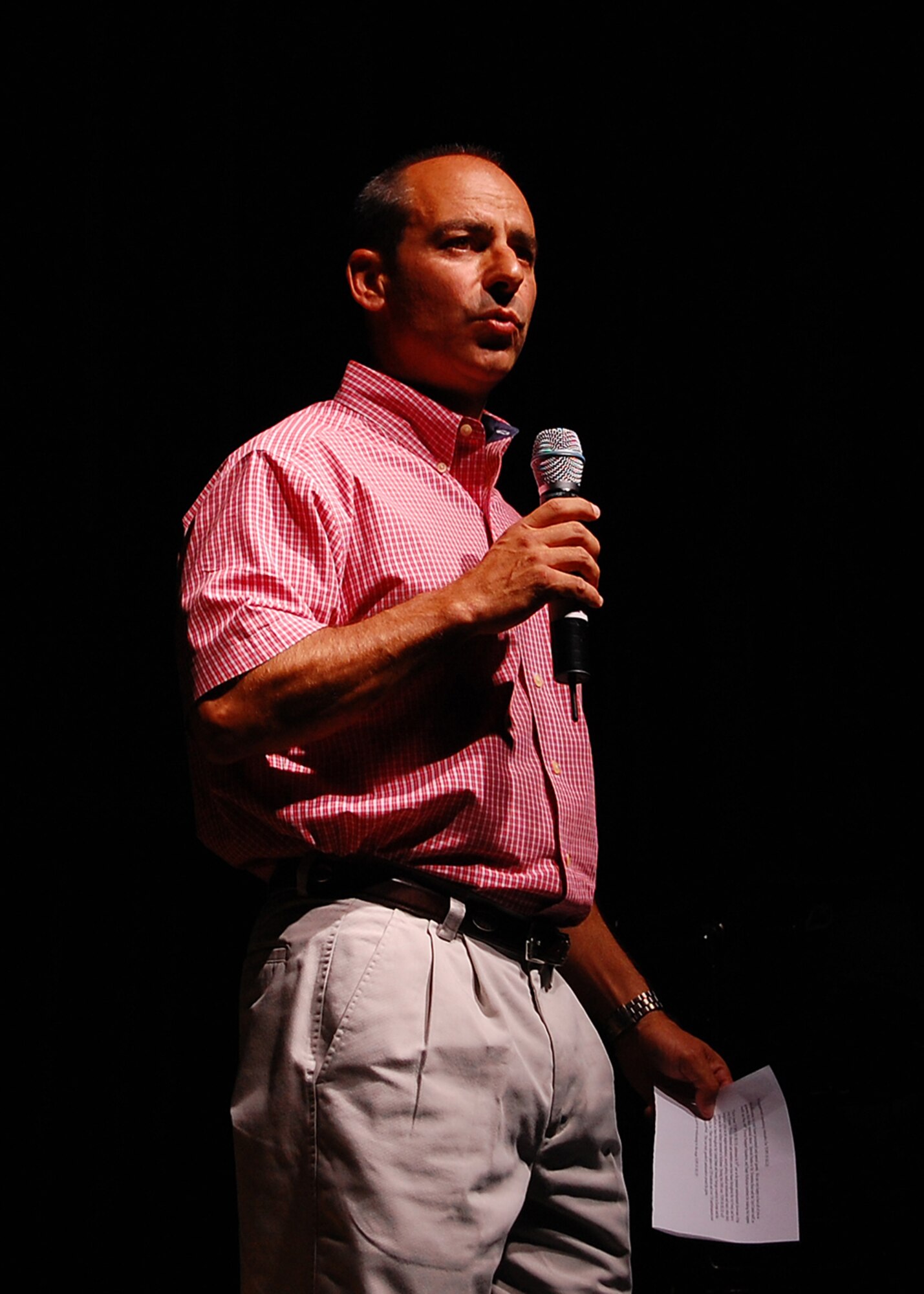 Col. Jeff Harrigian, 49th Fighter Wing commander speaks at Tops in Blue in the Tays Special Events Center on the University of New Mexico-Alamogordo campus, June 2. (U.S. Air Force photo/Airman 1st Class Michael Means)