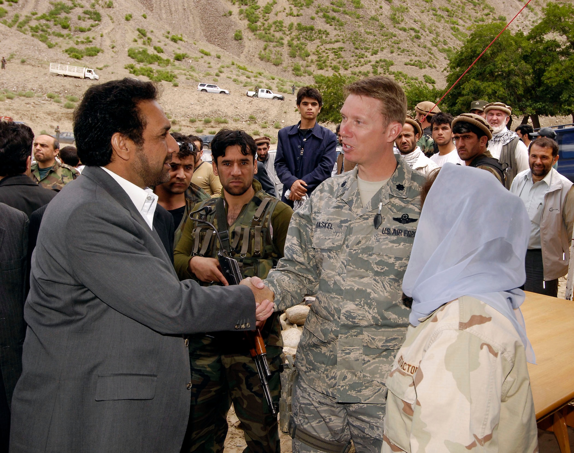 Afghan Vice President Ahmad Zia Massoud shakes hands with Lt. Col. Russell Kaskel at a groundbreaking ceremony for the new $6 million Barak to Khenj road May 28 in Barak of the Bazarak District of the Panjshir province in Afghanistan. The 18-kilometer, two-lane road is scheduled to be completed in March 2009. Colonel Kaskel is the Panjshir Provincial Reconstruction Team commander. (U.S. Air Force photo/Master Sgt. Demetrius Lester) 
