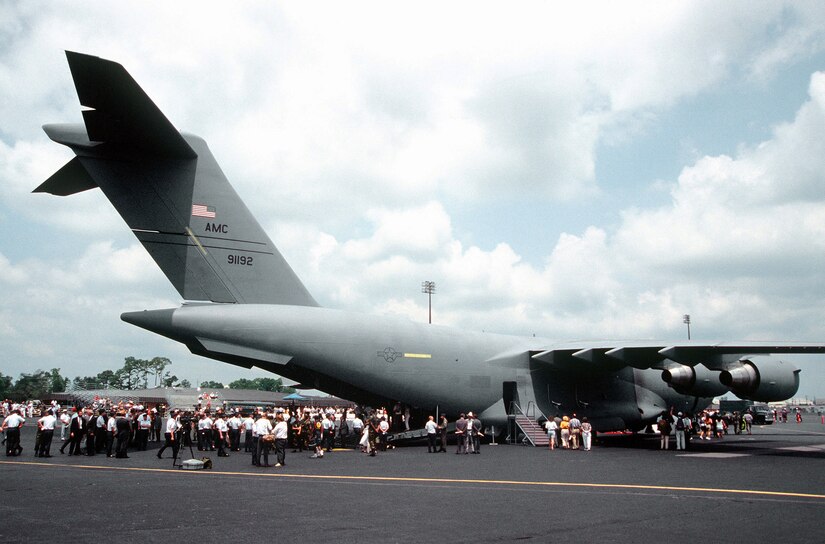 The "Spirit of Charleston," the first C-17 delivered to the 437th Airlift Wing, is surrounded by Airmen and their families, members of the media and Air Force leadership after turnover ceremonies June 14, 1993. (U.S. Air Force photo/Ken Hackman)