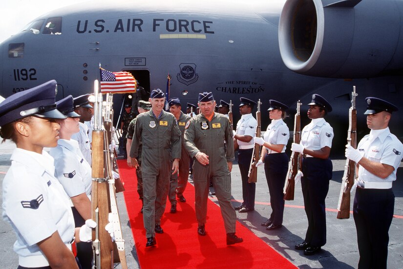 Gen. Merill McPeak and Gen. Ronald Fogelman disembark the "Spirit of Charleston," the first C-17 to be delivered to the Air Force June 14, 1993.  At the time, General McPeak was the Chief of Staff of the Air Force and General Fogelman was the commander of Air Mobility Command. (U.S. Air Force photo/Ken Hackman)