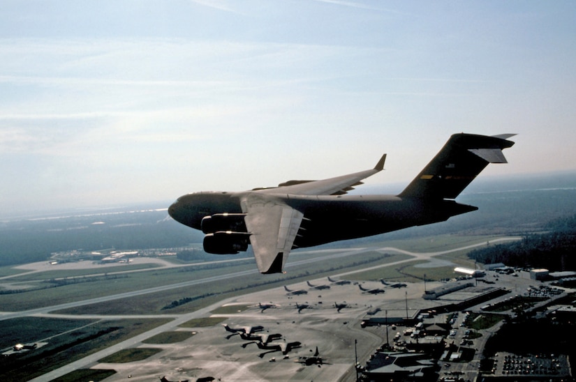 The "Spirit of Charleston," the first C-17 to be delivered to the Air Force flies over the Charleston AFB flightline during initial flights after delivery to the base. June 14 marks 15 years of service for the C-17. (U.S. Air Force photo/Tech. Sgt. David McLeod)