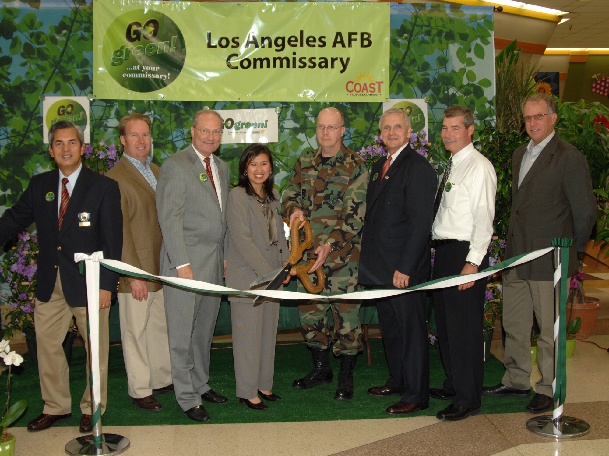 A ribbon cutting ceremony was held at the commissary to dedicate a newly installed solar panel system, May 28. It’s the first commissary in the world to go solar. The photovoltaic cells will produce enough power each day to light 10 households. Pictured from left to right are:  Al Alferez, LAAFB Commissary store director; Troy Strand, vice president of Independent Energy Solutions; Scott Simpson, director, Defense Commissary Agency West; Tawny Tran, project manager, Innovative Technical Solutions Inc.; Col. David Raths, 61st ABW vice commander; Rick Page, acting director, Defense Commissary Agency; Ed Wilson  61st CELS project officer; and Mike Garabroni, quality control manager, Innovative Technical Solutions Inc. (Photo by Lou Hernandez)