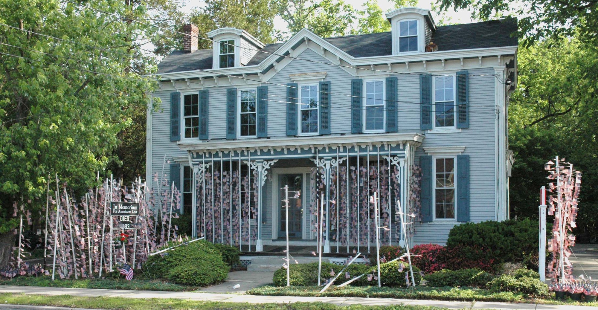 This is the scene of a flag memorial built by Mr. Michael Bloom of Cherry Hill, N.J., honoring fallen U.S.  servicemembers in Iraq was vandalized in April 2008, prior to being rebuilt by Airman volunteers May 28, 2008. The Airmen who volunteered came from the U.S. Air Force Expeditionary Center at Fort Dix, N.J.   Mr. Bloom, an architect, started this memorial five years ago and has been adding flags for every servicemember lost. (U.S. Air Force Photo/Staff Sgt. Paul R. Evans)