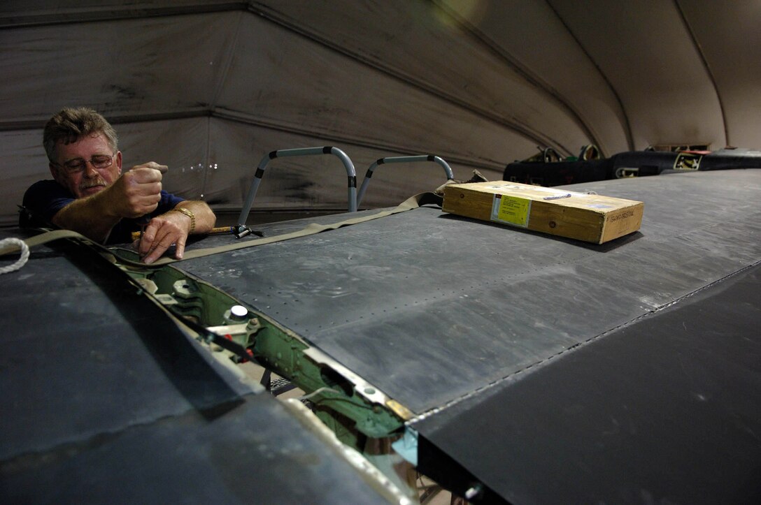 Grady Lollis conducts phase maintenance on a U-2 May 23 at a Southwest Asian air base. Mr. Lollis is a 380th Expeditionary Aircraft Maintenance Squadron phase dock crew member. (U.S. Air Force photo/Senior Airman Levi Riendeau) 