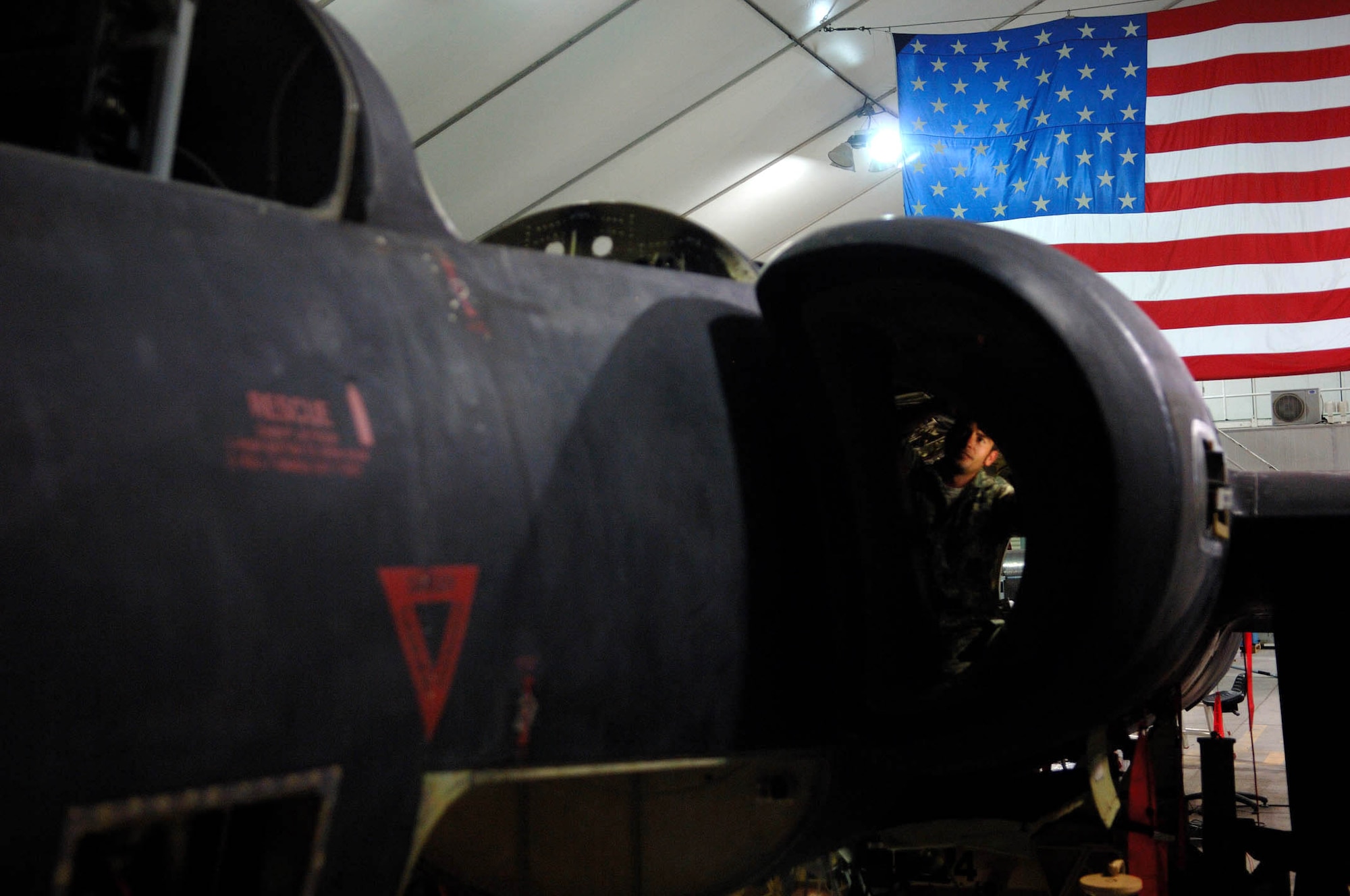 Jeremy Matthews conducts phase maintenance on a U-2 May 23 at a Southwest Asian air base. Mr. Matthews is assigned to the 380th Expeditionary Aircraft Maintenance Squadron. (U.S. Air Force photo/Senior Airman Levi Riendeau) 