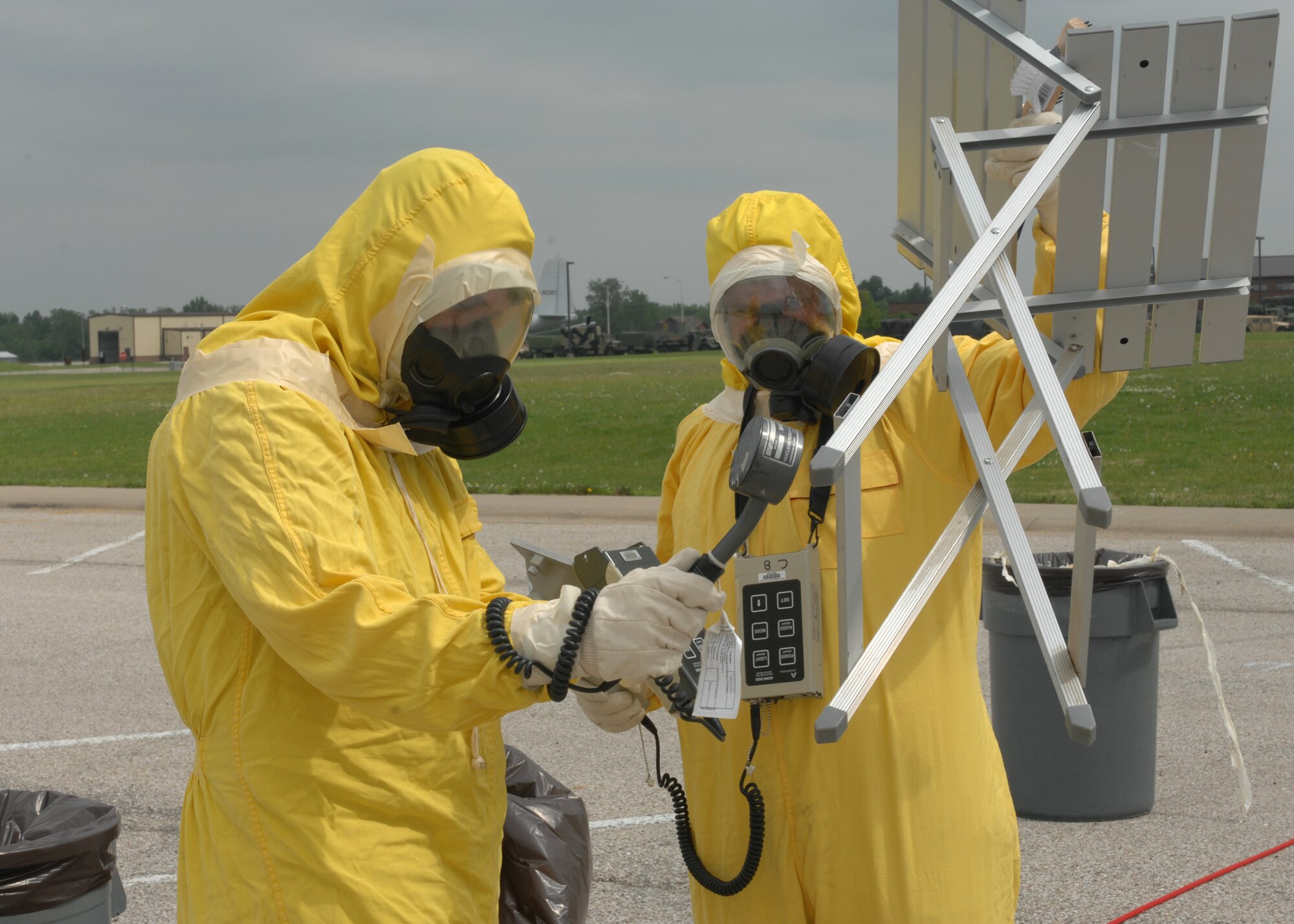 WHITEMAN AIR FORCE BASE, Mo. – Staff Sgt. Jeremy Franklin and Staff Sgt. Matthew Street, 509 Civil Engineer Squadron, perform breakdown procedures May 28by monitoring the equipment of the contamination control station to ensure that the equipment was not found contaminated after operation . (U.S. Air Force photo/Tech. Sgt. Samuel A. Park)