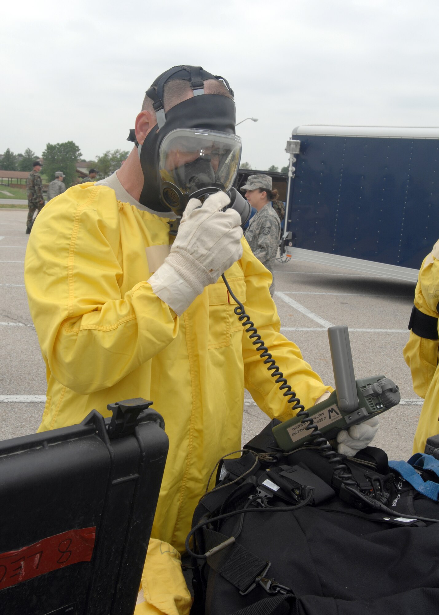 WHITEMAN AIR FORCE BASE, Mo. – Tech. Sgt. Nathan Kidwell, 509 Civil Engineer Squadron, dress out May 28 to perform procedures for training to identify a clean area for the set up of the CCS and calling in coordinates the Mobile Emergency Operations Center.  (U.S. Air Force photo/Tech. Sgt. Samuel A. Park) 