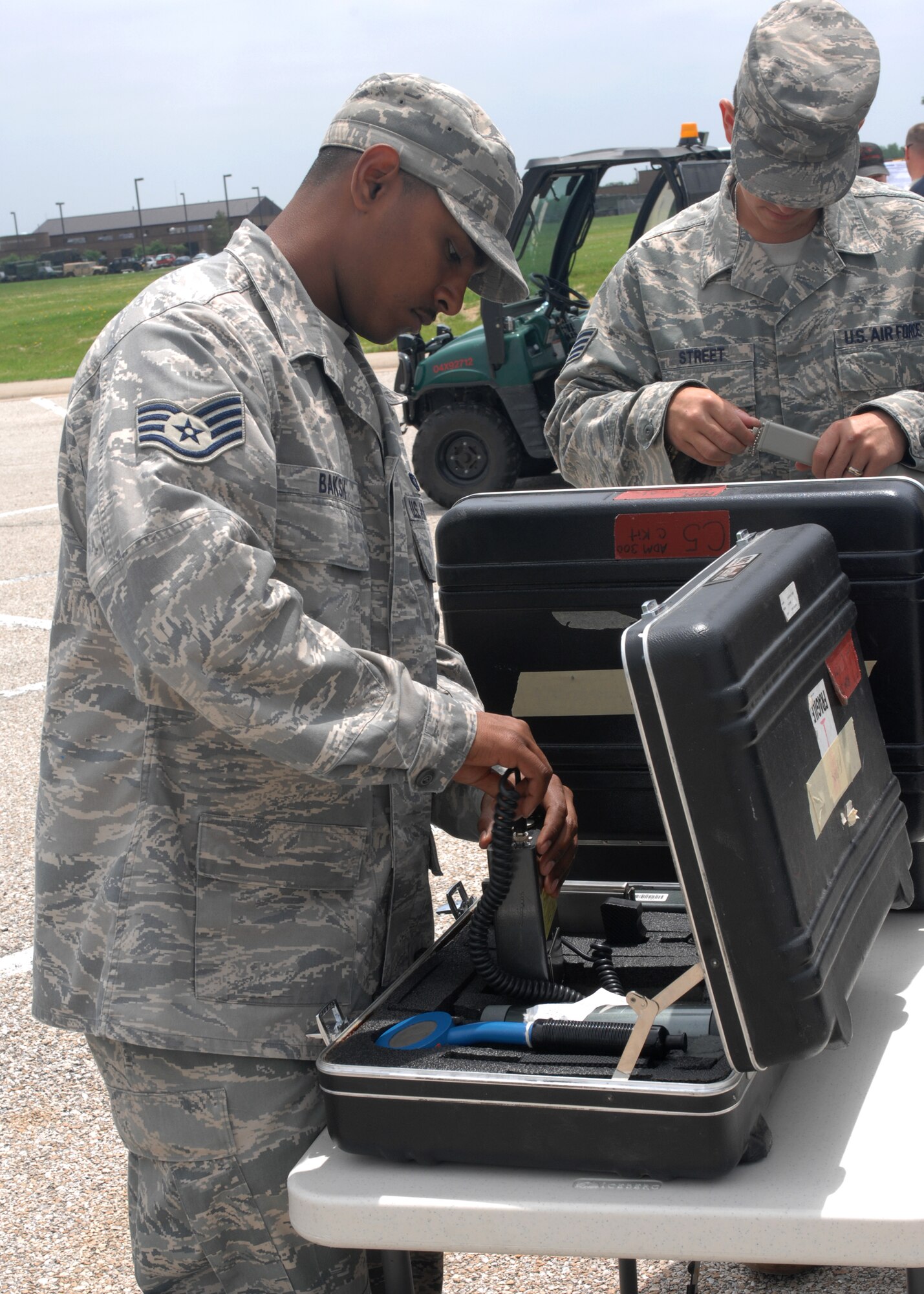 WHITEMAN AIR FORCE BASE, Mo. – Staff Sgt. Kepler Baksh and Staff Sgt. Matthew Street, 509 Civil Engineer Squadron, perform operational checks May 28 on the ADM 300  durign a training session that would be utilized inside the CCS to detect any type of radiological contamination. (U.S. Air Force photo/Tech. Sgt. Samuel A. Park)