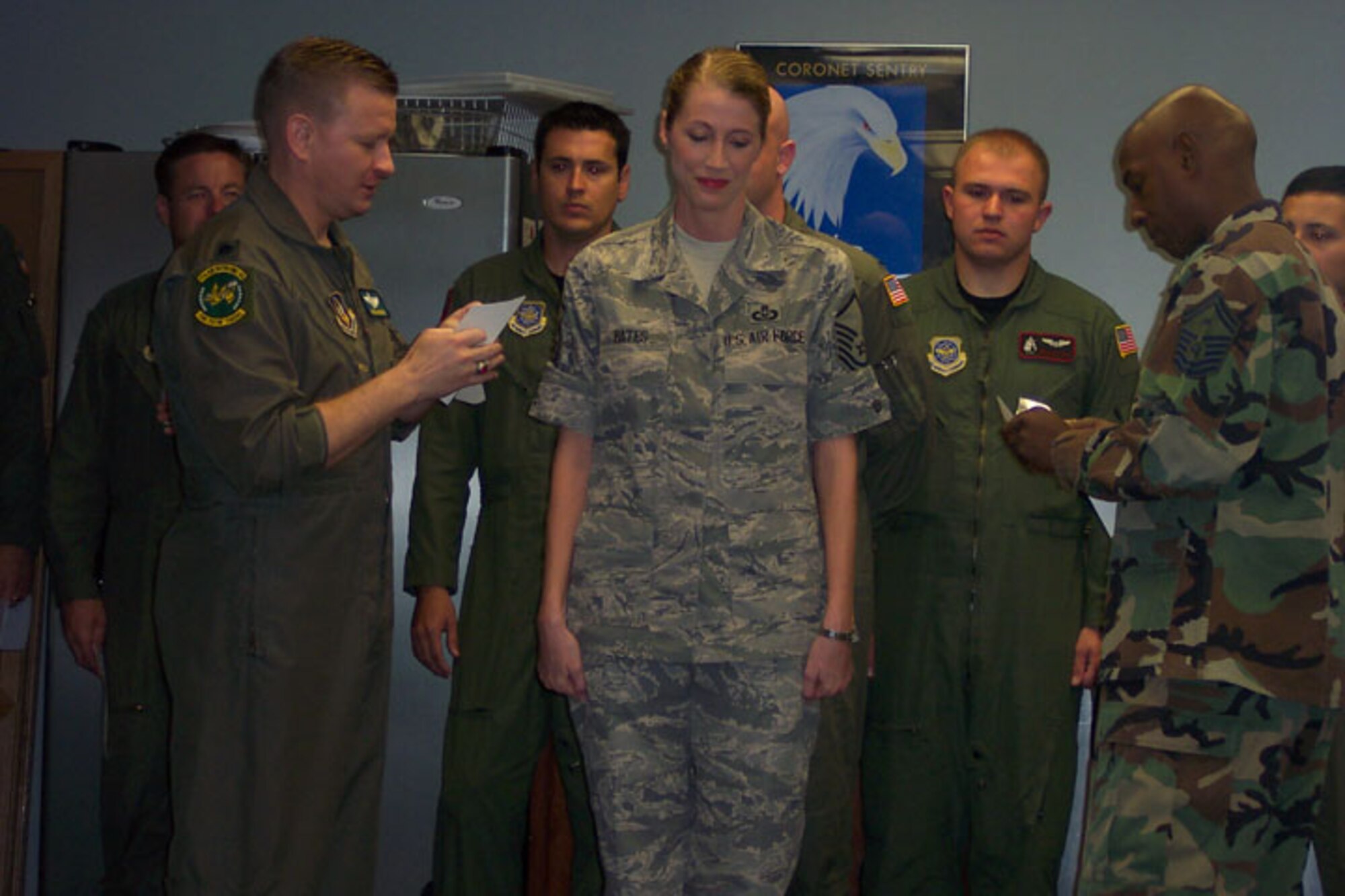 SEYMOUR JOHNSON AIR FORCE BASE, N.C. -- Reservist Dana Bates receives her new senior master sergeant stripes from Lt. Col. Scheid Hodges (left), 77th Air Refueling Squadron commander and Senior Master Sgt. Terry McCabe (right). Sgt. Bates is the 916th Aircrew Flight Equipment Superintendent.