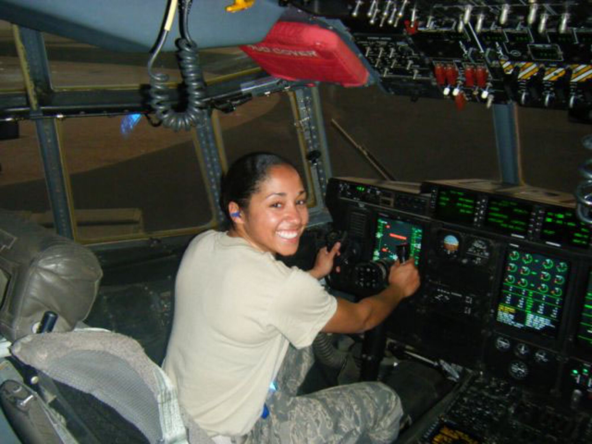 SEYMOUR JOHNSON AIR FORCE BASE, N.C. -- Senior Airman Ariel Austin sits at the controls of a C-130 Hercules at her deployed location in Al Udeid. Airmen Austin is a Reservist with the 916th Logistics Readiness Squadron and serves as a fuels apprentice.