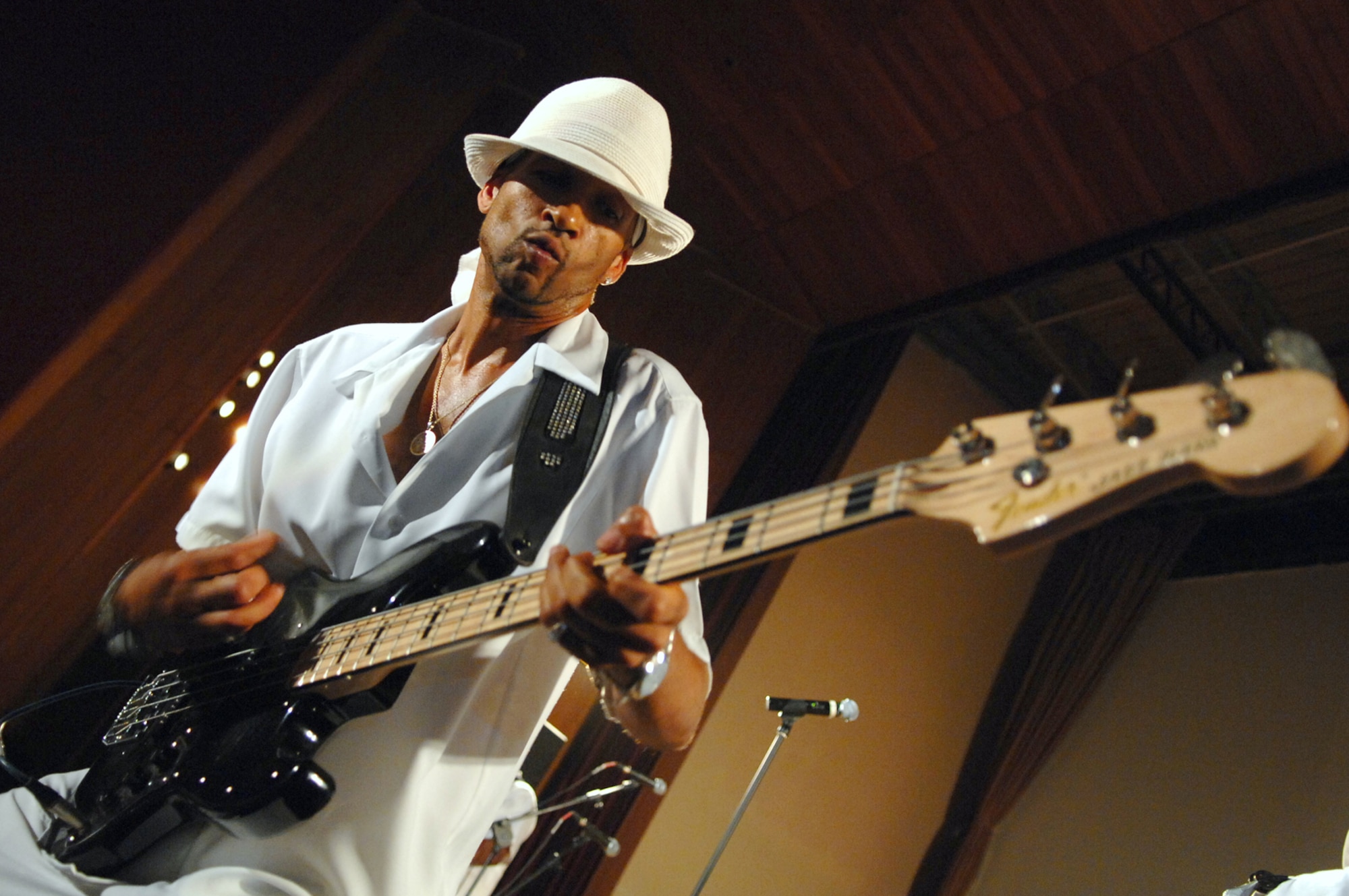BALAD AIR BASE/LOGISTICS SUPPORT AREA ANACONDA, Iraq -- Lead bassist for Con Funk Shun, Eric Young, performs for personnel here, June 1. The Legends of Funk, a 14-member group consisting of three separate bands, the Barkays, Con Funk Shun and the Dazz Band toured several Air Force and Army assets here May 31 and June 1 to gain a better understanding of the military mission and lifestyle in a combat zone, before their concert June 1. (U.S. Air Force photo/ Senior Airman Julianne Showalter)