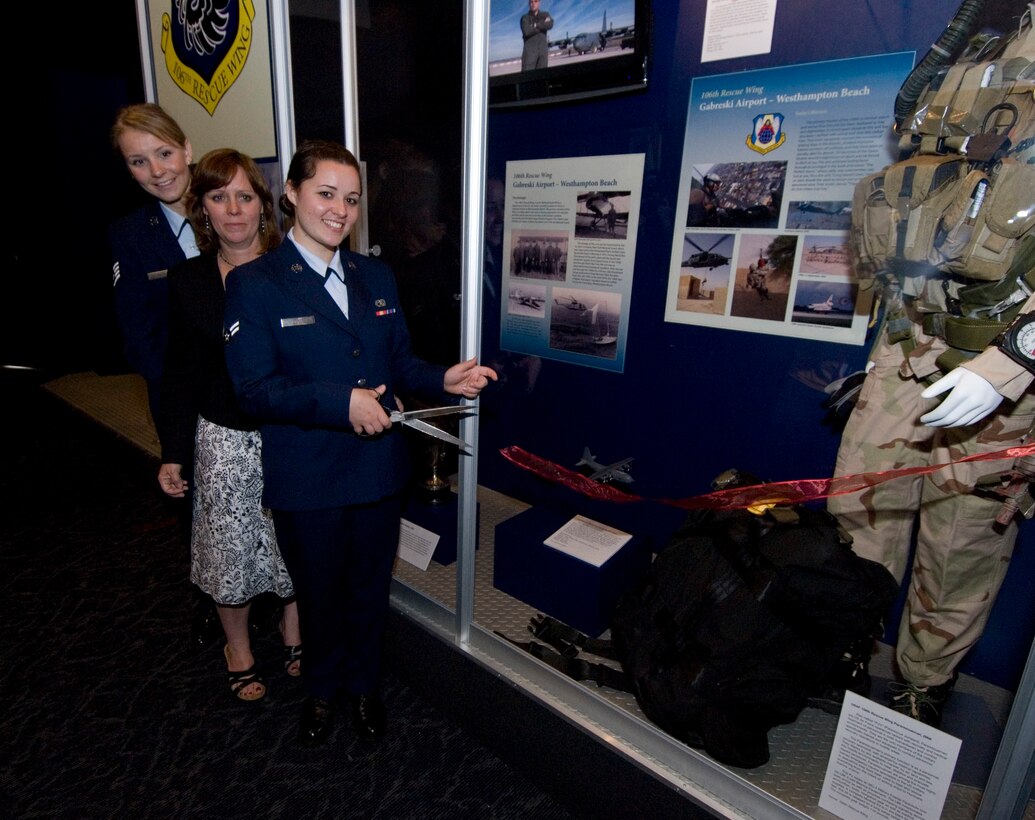 Cradle of Aviation Museum, Garden City, N.Y. --
On May 15, 2008 Staff Sgt. Erica Smith, Avaition Research Management NCOIC, Airman Fist Class Kristen Smith, H-60 Crew Chief, and their mother Maryann Smith-Stahl, widow of Rick Smith,  were all present to help cut the ribbon on the 106th's new permanent exhibit in the Cradle of Aviation Museum.
Airmen from the 106th Rescue Wing, members of the "Friends of the 106th," and other civilians attended the 100th anniversary of the106th at the Cradle of Aviation Museum in Garden City, N.Y. The event included the unveiling of a new permanent exhibit focused solely on the Wing, and speakers Wing Commander Col. Michael F. Canders, survivor #290, Stephen White, and keynote speaker Michael Balboni, Deputy Secretary for Public Safety. 
(Official USAF Photo by Staff Sgt. David J. Murphy)