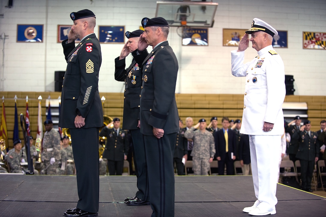 U.S. Army Command Sgt. Maj. Robert A. Winzenried, U.S. Forces Korea, U.S. Army Gen. Burwell "B.B." Bell and Gen. Walter "Skip" Sharp, and U.S. Navy Adm. Timothy Keating, commander, U.S. Pacific Command, salute during the change of command ceremony for commander, U.S. Forces Korea, June 3, 2008. Sharp assumed command from Bell as the top U.S. military post on the Korean peninsula. 