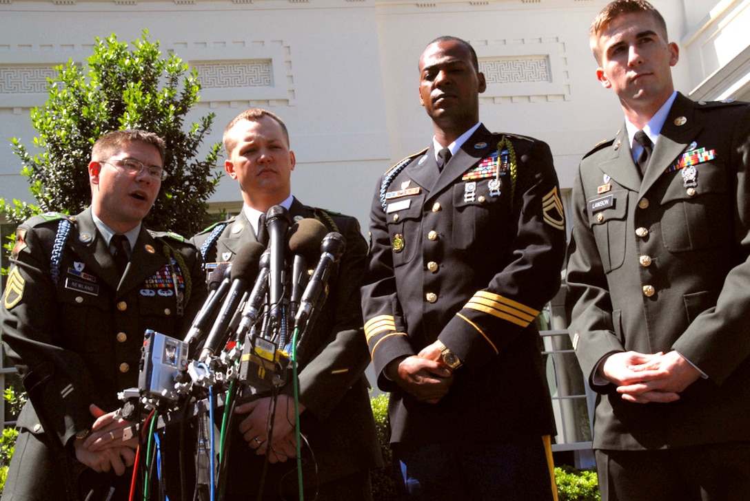 Retired U.S. Army Staff Sgt. Ian Newland, left, Army Sgt. Lyle Buehler, Army Sgt. 1st Class Cedric Thomas and Army Spc. Sean Lawson are alive because of Spc. Ross McGinnis's selfless sacrifice. McGinnis, who received the Medal of Honor posthumously in a White House ceremony, June 2, 2008, covered a live grenade with his body after it had entered a Humvee that all five soldiers were riding in. He absorbed the majority of the blast, saving the rest of his crew.

