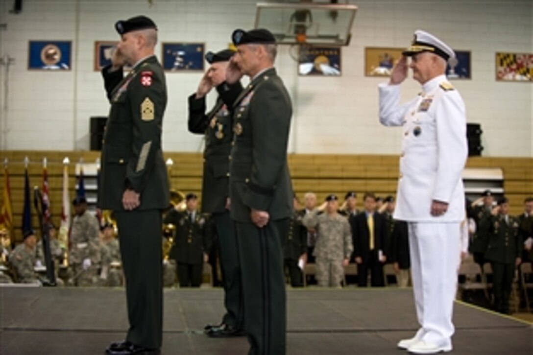 U.S. Army Command Sgt. Maj. Robert A. Winzenried, U.S. Forces Korea, U.S. Army Gens. Burwell "B.B." Bell and Walter "Skip" Sharp, and U.S. Navy Adm. Timothy Keating, commander, U.S. Pacific Command, salute the passing of the colors during the change of command ceremony for  commander, U.S. Forces Korea, June 3, 2008. Sharp relieved Bell at the top U.S. military post on the Korean peninsula. 