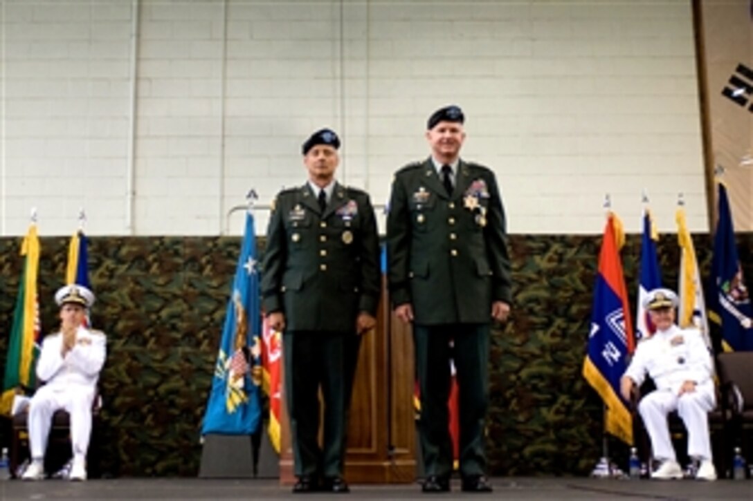 U.S. Army Gen. Walter "Skip" Sharp, left, and U.S. Army Gen. Burwell "B.B." Bell stand at the conclusion of the change of command ceremony for commander, U.S. Forces Korea, June 3, 2008. U.S. Navy Adm. Mike Mullen, rear left, chairman of the Joint Chiefs of Staff, and U.S. Navy Adm. Timothy Keating, rear right, commander, U.S. Pacific Command, participated in the ceremony. Sharp assumed command from Bell at the top U.S. military post on the Korean peninsula. 