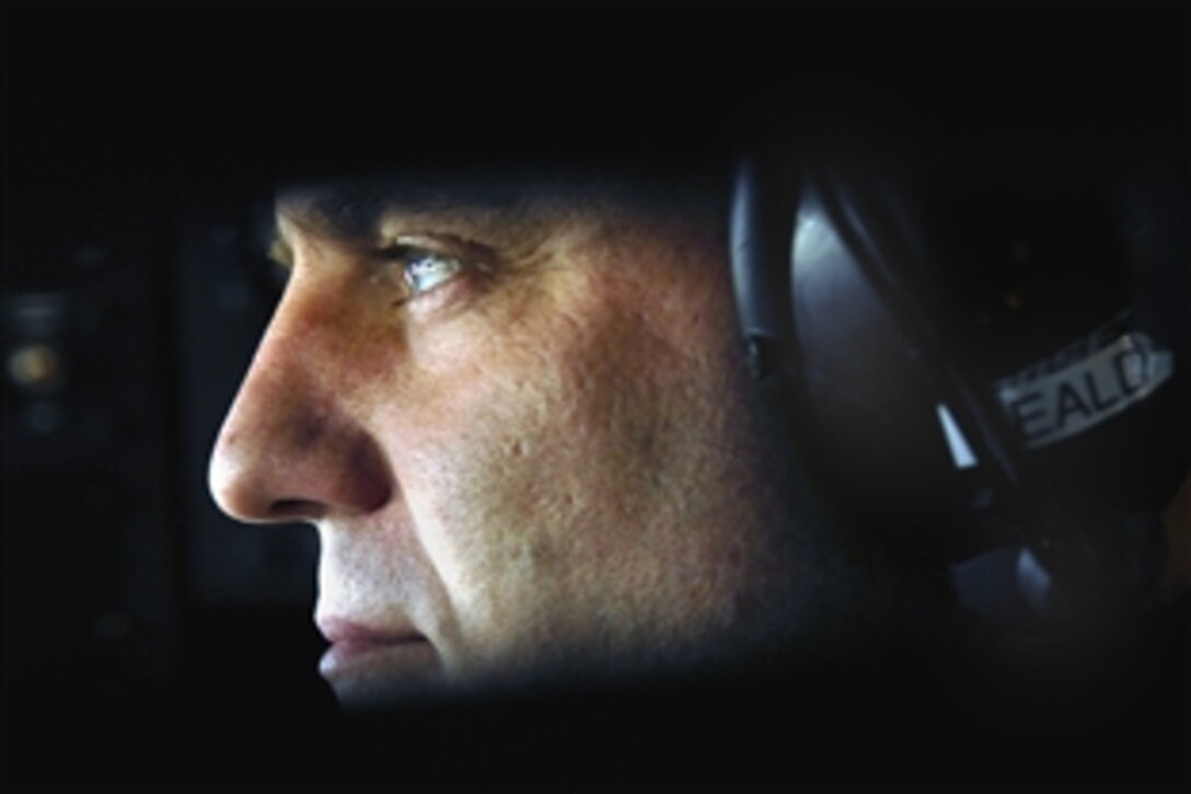 U.S. Air Force Master Sgt. Chuck Heald waits for an engine start on a KC-135R Stratotanker aircraft on Manas Air Base, Kyrgyzstan, May 27, 2008, prior to a refueling mission over Afghanistan. 