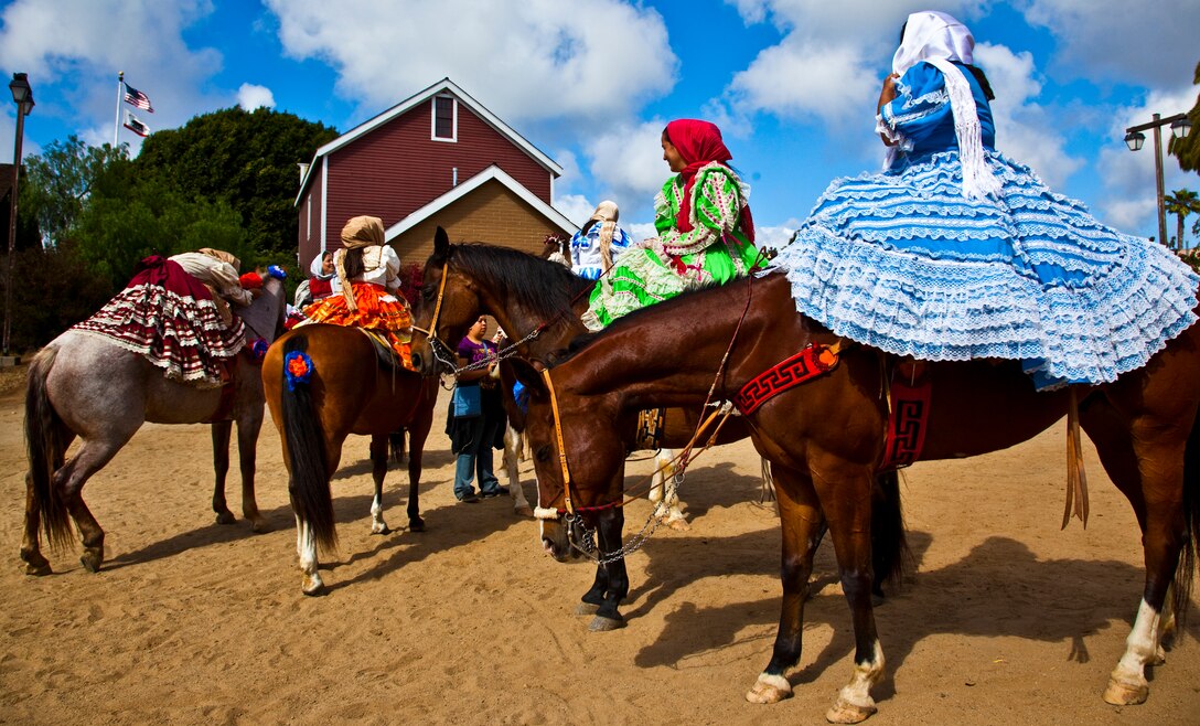 The bridal party prepares before a re-enactment of a traditional Mexican wedding in Old Town San Diego June 6. This demonstration was one of many displaying the many parts that women played in Southern California in the late 19th century. Other demonstrations included candle making, yarn spinning and basket weaving.