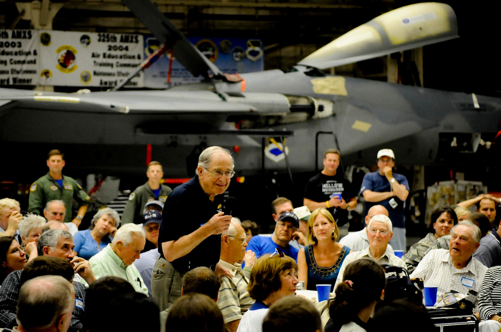 Tech. Sgt. (Ret.) Olen  Medley, a former P-38 Lightning dedicated crew chief, spoke to a hangar full of current and former members of the 95th Fighter Squadron during the 2008 'Bonehead' Reunion held May 30 - June 1. TSgt. (Ret.) Medley served during WWII as a mechanic for P-38 aircraft assigned to the 95th Fighter Squadron from 1943-1945.  (Photo by Capt. Justin Ripley)