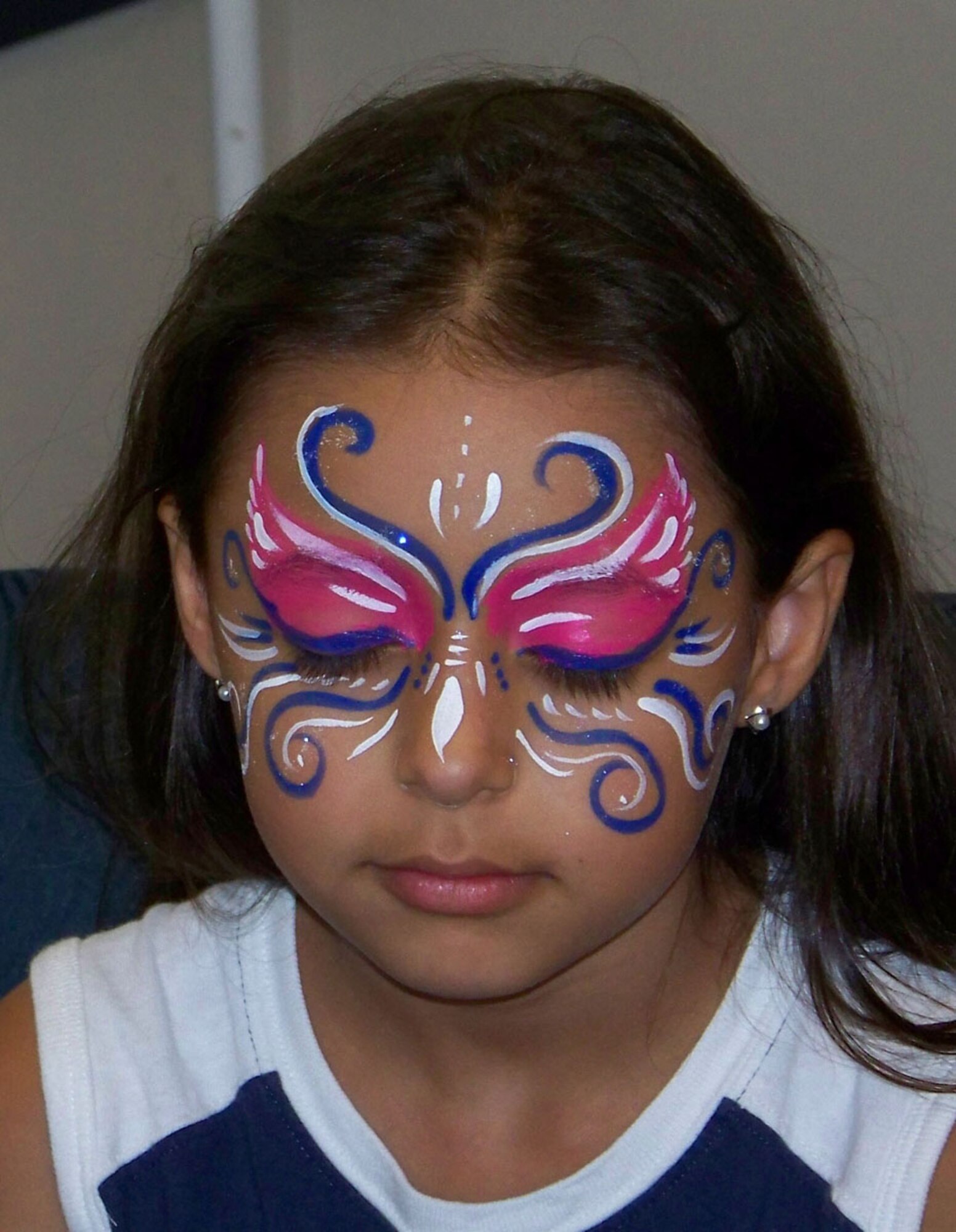 Morgan Feliciano, daughter of Staff Sgt. Joshua Feliciano, 917th Security Forces Squadron, models her face painting during the 917 SFS Family Day Wednesday, June 4. (U.S. Air Force photo/Master Sgt. Sherri Bohannon)