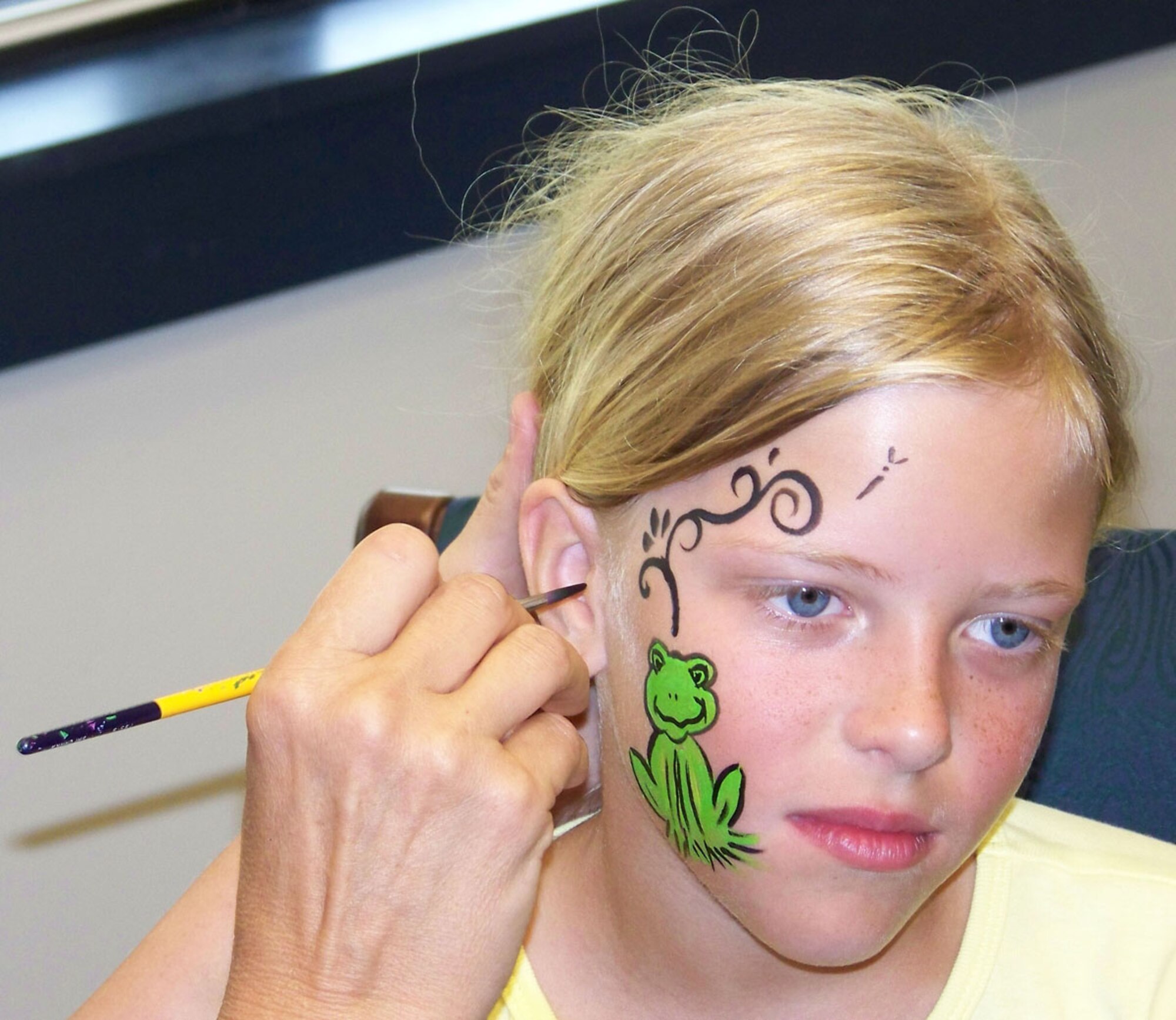 Emilie Mudd, daughter of Staff Sgt. David Mudd, 917th Security Forces Squadron, has her face painted during the 917 SFS Family Day Wednesday, June 4, Barksdale AFB, La. (U.S. Air Force photo/Master Sgt. Sherri Bohannon)
