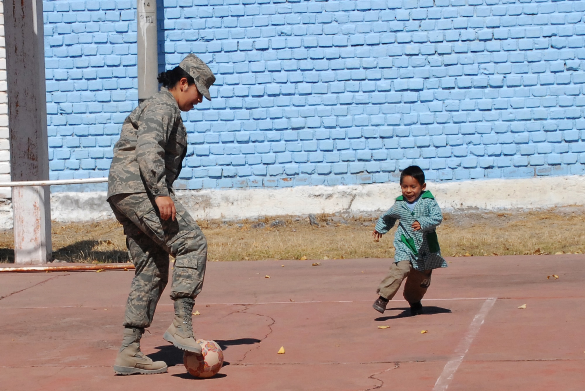 U.S. Air Force 1st Lt. Mary Pekas,  the public affairs officer assigned to Task Force New Horizons Peru, deployed from Davis-Monthan Air Force Base, Ariz., enjoys a game of soccer with Diego Omar Palomino Guerrero, 5, during a visit to I.E. Inicial CRL. Miguel Peñarrieta Elementary School June 4 in Los Cabitos, Peru, the location at which U.S. military members are based in support of New Horizons Peru 2008, a humanitarian event that benefits thousands of Peruvians. (U.S. Air Force photo/ Airman 1st Class Tracie Forte)