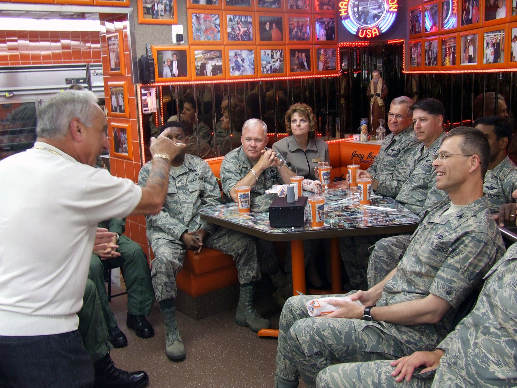 Mr. Joey Vento, owner of the nationally-known Geno's Steaks restaurant in Philadelphia, tells a story to Lt. Gen. Chris Kelly, Air Mobility Command vice commander, Col. Steven Bernard, 621st Contingency Response Wing commander at McGuire Air Force Base, N.J., Col. Balan Ayyar, 305th Air Mobility Wing commander at McGuire, Col. Michael Hutchison, 305th Mission Support Group commander at McGuire, and others during a lunch visit to the restaurant May 29, 2008.  The stop was part of events for Air Force Week in Philadelphia.  (U.S. Air Force Photo/Tech. Sgt. Scott T. Sturkol)