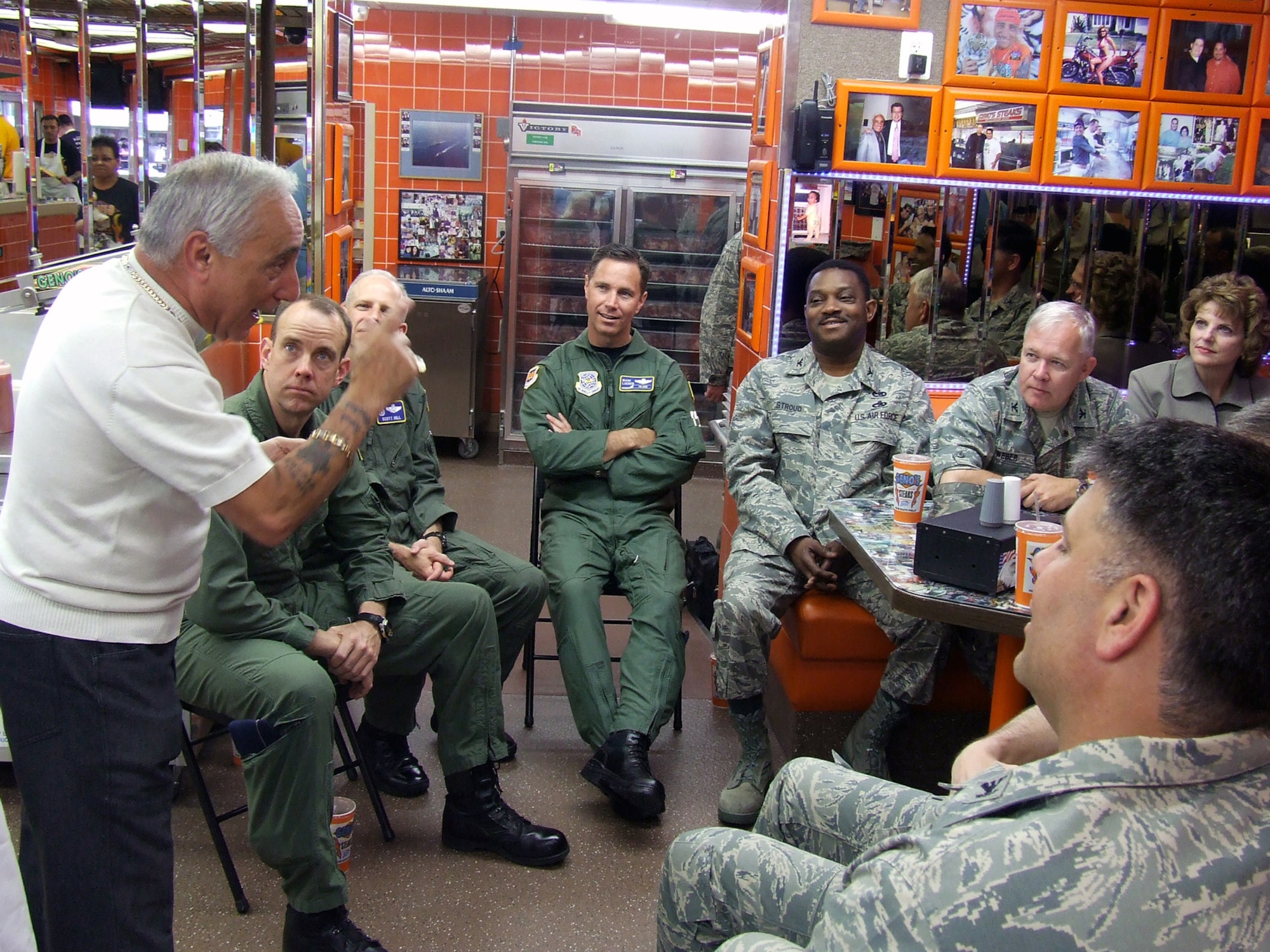 Mr. Joey Vento, owner of the nationally-known Geno's Steaks restaurant in Philadelphia, tells a story to Air Force visitors during a lunch visit to the restaurant May 29, 2008.  The stop was part of events for Air Force Week in Philadelphia.  Among the visitors were Lt. Gen. Chris Kelly, Air Mobility Command vice commander.  (U.S. Air Force Photo/Tech. Sgt. Scott T. Sturkol)