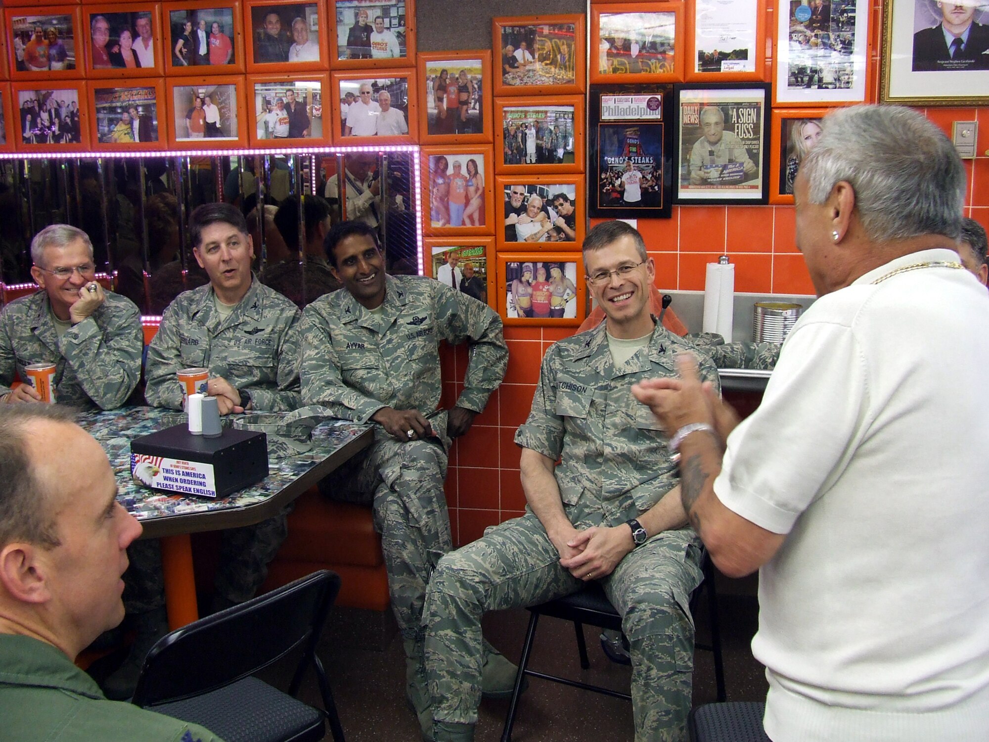 Mr. Joey Vento, owner of the nationally-known Geno's Steaks restaurant in Philadelphia, tells a story to Lt. Gen. Chris Kelly, Air Mobility Command vice commander, Col. Steven Bernard, 621st Contingency Response Wing commander at McGuire Air Force Base, N.J., Col. Balan Ayyar, 305th Air Mobility Wing commander at McGuire, Col. Michael Hutchison, 305th Mission Support Group commander at McGuire, and others during a lunch visit to the restaurant May 29, 2008.  The stop was part of events for Air Force Week in Philadelphia.  (U.S. Air Force Photo/Tech. Sgt. Scott T. Sturkol)