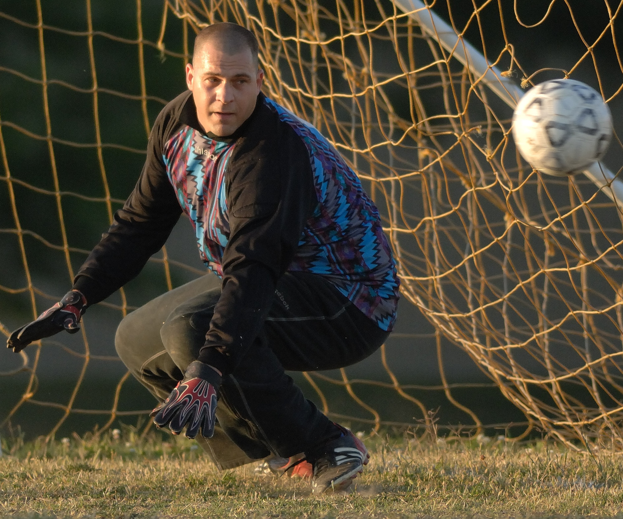 LANGLEY AIR FORCE BASE, Va. – The ball goes past Tech. Sgt. Bryan Baumgartl, 1st Aerospace Medicine Squadron, during the intramural soccer championship May 29.  The 1st Logistics Readiness Squadron defeated the 1st Medical Surgical Squadron with a score of 2 to 0 and became Langley's intramural soccer champions. (U.S. Air Force photo/Senior Airman Barry Loo)