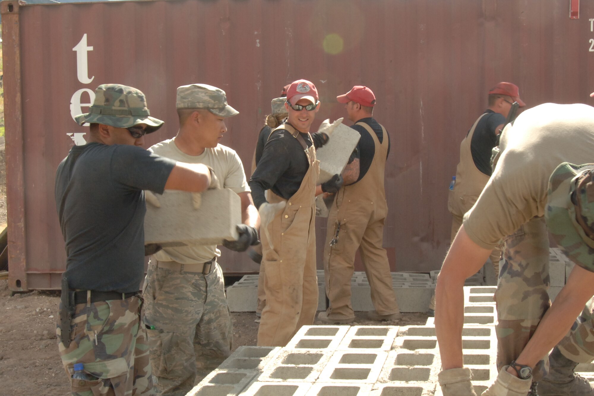 U.S. Airmen assigned to Task Force New Horizon Peru 2008 stack cement blocks to begin the construction of a clinic in Yanama, Peru in support of New Horizons Peru 2008, a humanitarian event that benefits thousands of Peruvians. Nearly 300 members from the U.S. Air Force, Army, Marines, and Navy came together to provide Peruvians with new schools, clinics, and water wells. (U.S. Air Force photo/Tech. Sgt. Kerry Jackson)