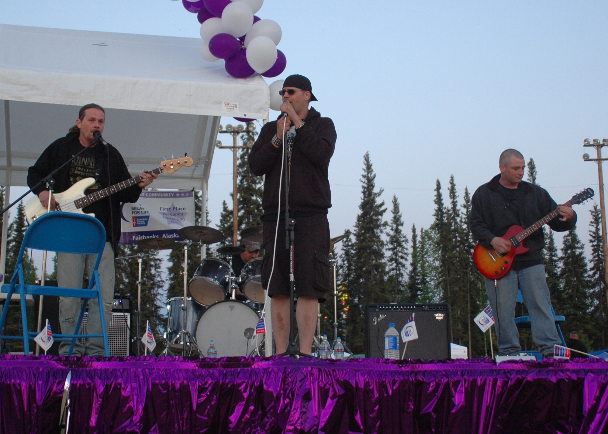 Tech. Sgt. John Kehres, 354th Aircraft Maintenance Squadron weapons crew chief, (far right) plays guitar with his band, Dystopia, at a cancer benefit May 31, 2008, at the West Valley High School in Fairbanks. Sergeant Kehres and his band mates, brothers Justin (vocals) and Rob Smith (bass guitar), and Mitch Higgins (drums), met in 1992 during Sergeant Kehre?s first tour at Eielson. In 1999 Sergeant Kehres got reassigned to Pope AFB, N.C., but came back to Eielson afterwards and has been here with his family ever since. (U.S. Air Force photo by Airman 1st Class Nora Anton)