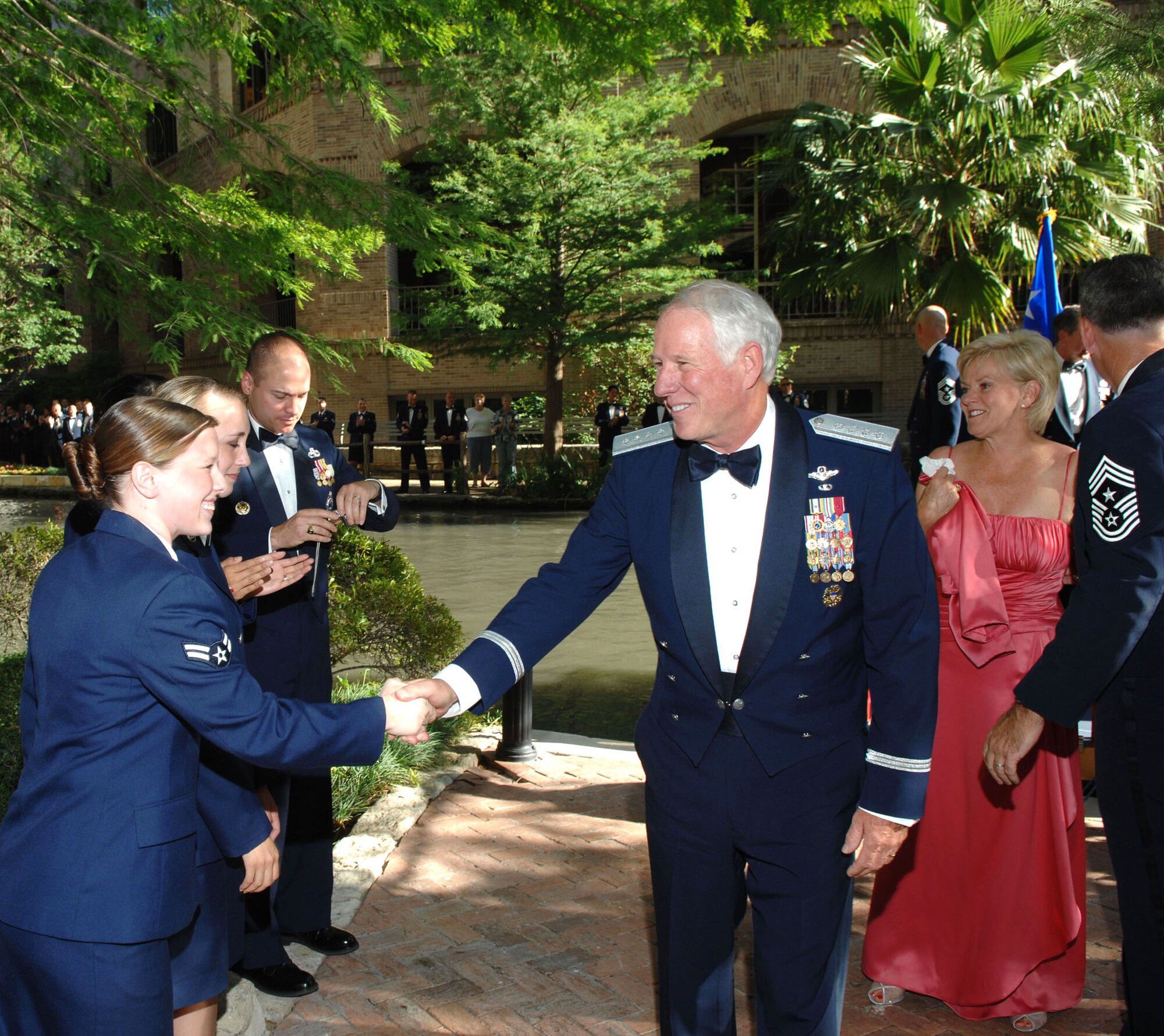 Gen. William R. Looney III greets an Airman after arriving for the Order of the Sword presentation ceremony May 30 in San Antonio. Members of the command presented General Looney with the highest honor enlisted Airmen can give a leader. General Looney is the commander of Air Education and Training Command. (U.S. Air Force photo/Joel Martinez) 

