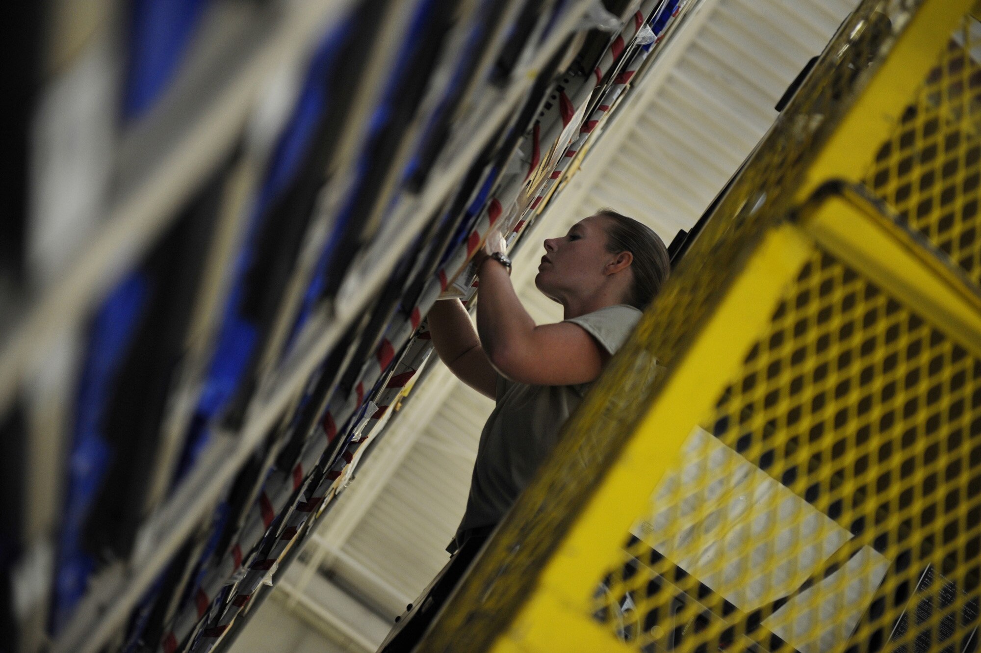 MOODY AIR FORCE BASE, Ga. -- Tech. Sgt. Brooke Blanton, 23rd Logistics Readiness Squadron non-commissioned officer in charge of C-130P Hercules parts, pulls property for customers here June 3. Thousands of parts line the warehouse and are ready to be used on C-130 Hercules and HH-60G Pave Hawks. (U.S. Air Force photo by Senior Airman Gina Chiaverotti) 