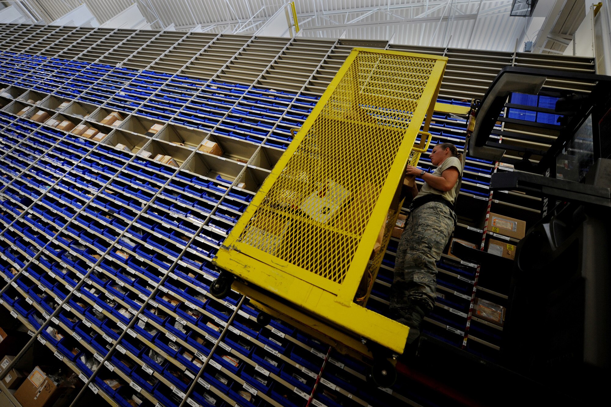 MOODY AIR FORCE BASE, Ga. -- Tech. Sgt. Brooke Blanton, 23rd Logistics Readiness Squadron non-commissioned officer in charge of C-130P Hercules parts, pulls property for customers here June 3. The parts are then used by maintainers to replace broken parts on C-130P Hercules and HH-60G Pave Hawks. (U.S. Air Force photo by Senior Airman Gina Chiaverotti) 