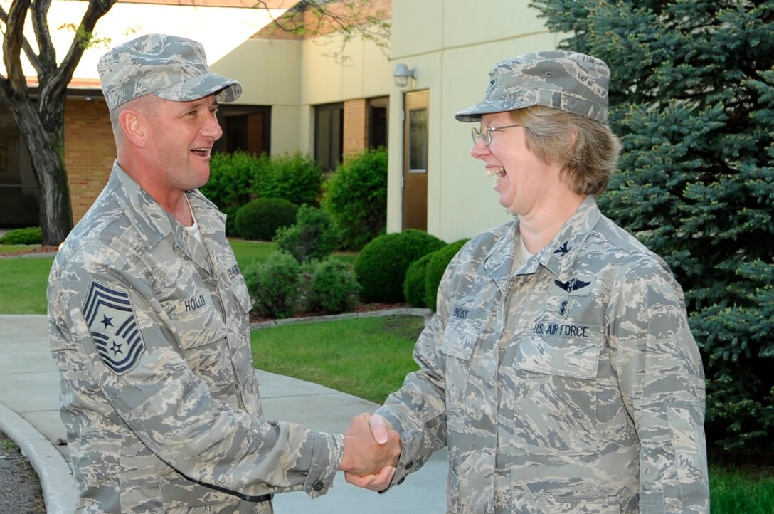 Col. Naomi Boss, 28th Medical Group commander, greets Chief Master Sgt. Lloyd Hollen, 12th Air Force command chief, outside of the medical group building June 3. Chief Hollen got acquainted with Ellsworth’s Airmen as their new 12th Air Force command chief while touring bases within the 12th Air Force. (U.S. Air Force photo/Airman 1st Class Kasey Zickmund)