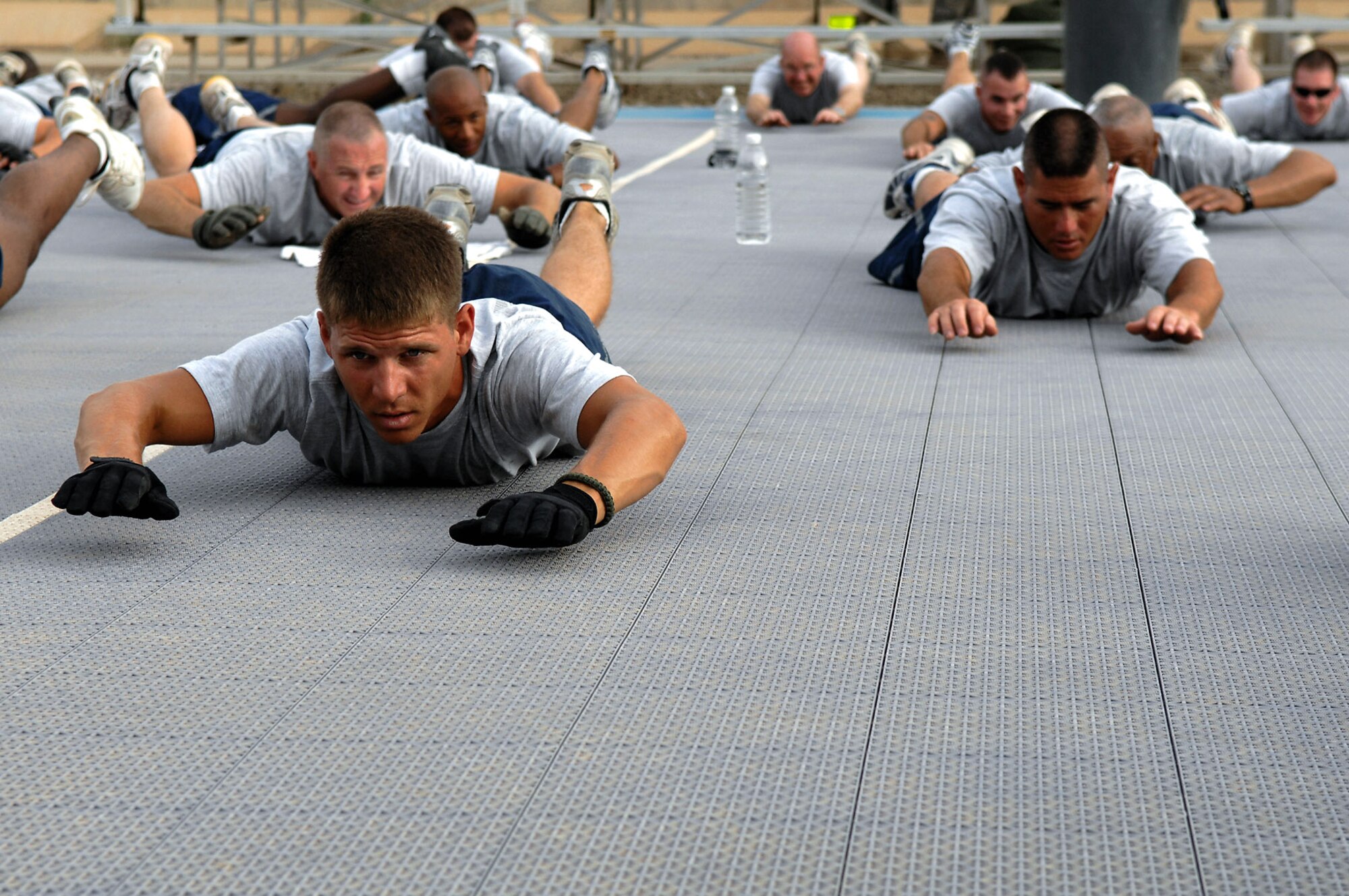 Staff Sgt. Patrick McPherson performs a superman exercise June 3 at Balad Air Base, Iraq. The exercise works muscles in the lower back. Members of the 557th Expeditionary RED HORSE Squadron meet early each morning to workout as a unit, promote the Air Force's fit-to-fight lifestyle and to build morale. The 557th ERHS staff provides direct support to the Army's 20th Engineer Brigade for large-scale construction projects throughout Iraq. Sergeant McPherson is a 557th ERHS structural maintenance member deployed from Patrick Air Force Base, Fla. (U.S. Air Force photo/Senior Airman Julianne Showalter) 
