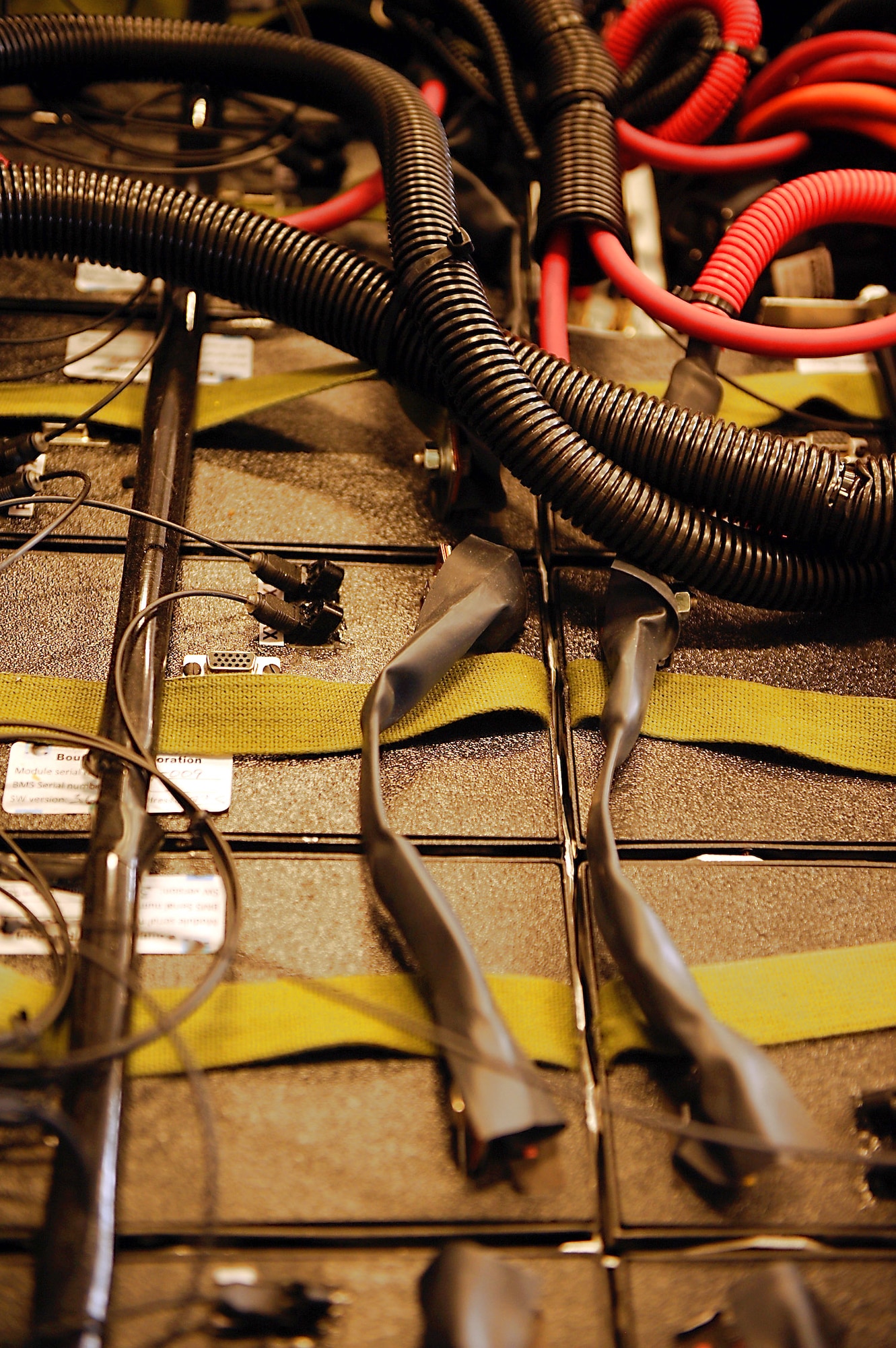 Shown are 20 lithium ion batteries used to power an electric munitions loader, which is part of an ongoing test for future electric-powered vehicles at Moody Air Force Base, Ga. (U.S. Air Force photo/Airman 1st Class Brittany Barker) 