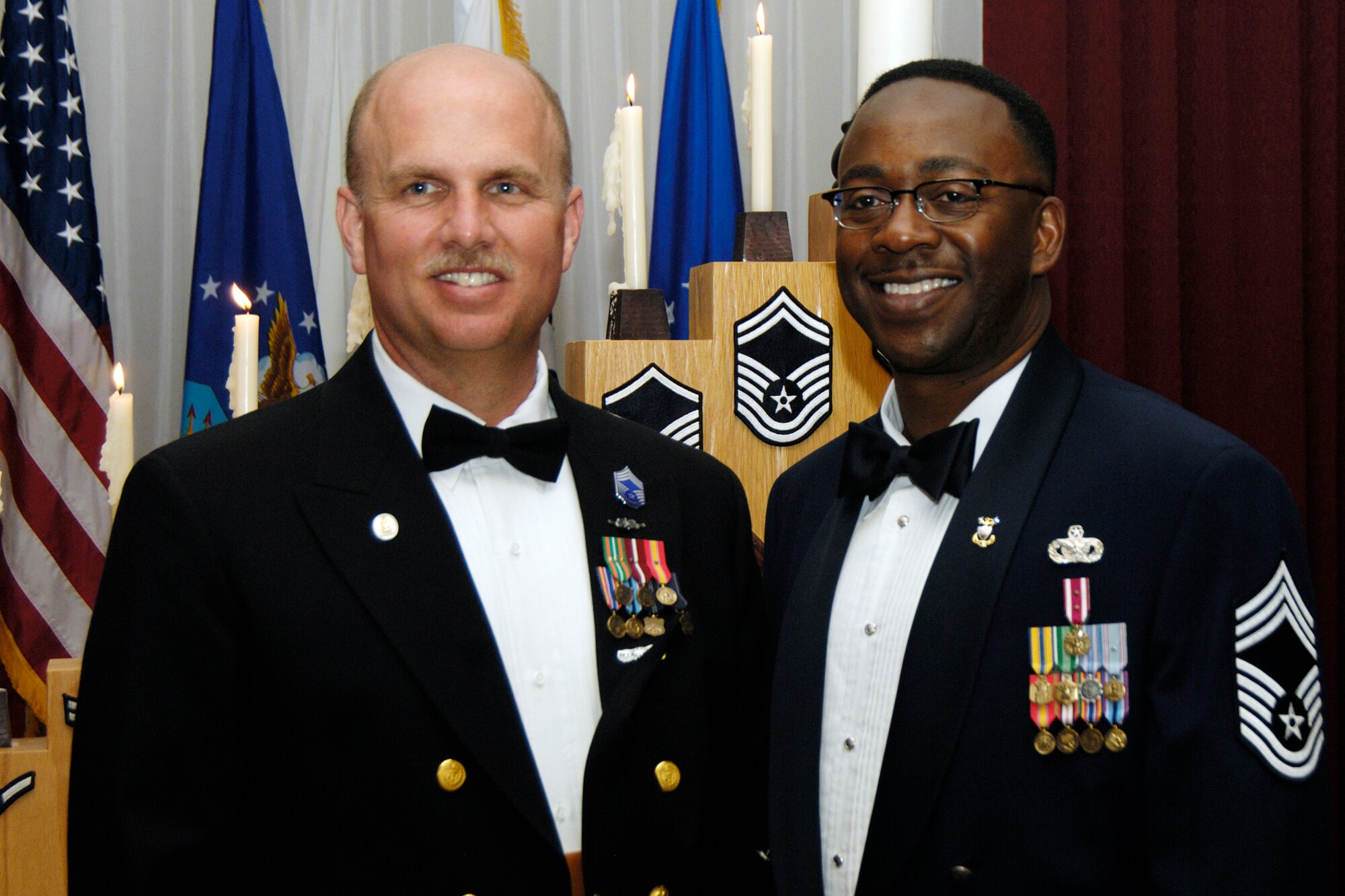 HANSCOM AFB, Mass. – Chief Master Sgt. Alphonso Thompson (right), 66th Security Forces Squadron superintendent, and Master Chief Petty Officer Joseph Smith (left), engineering officer with Maritime Safety and Security Team Boston, were honored during the Chief’s Recognition Ceremony on May 30 at the Minuteman Club. Col. Tom Schluckebier, 66th Air Base Wing commander hosted the event with the Hanscom Chiefs Group. (U.S. Air Force photo by Linda LaBonte Britt)