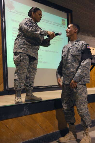 BALAD AIR BASE, Iraq -- Master Sgt. Karen Combs, director of the 332nd Air Expeditionary Wing Equal Opportunity Office, interacts with an Airman during a Right Start briefing here, May 30.  Right Start is a session of informational presentations that provide Airmen who are new to Balad AB with tips and contacts that lead to successful deployments. Sergeant Combs is responsible for meeting the needs of nearly 10,000 Airmen assigned to the 332 AEW who are deployed to locations throughout Iraq. Sergeant Combs, a Reservist deployed from Duke Field, Fla.; in her civilian career, she is the principal of Eglin Elementary School on Eglin Air Force Base, Fla. (U.S. Air Force photo /Staff Sgt. Mareshah Haynes)