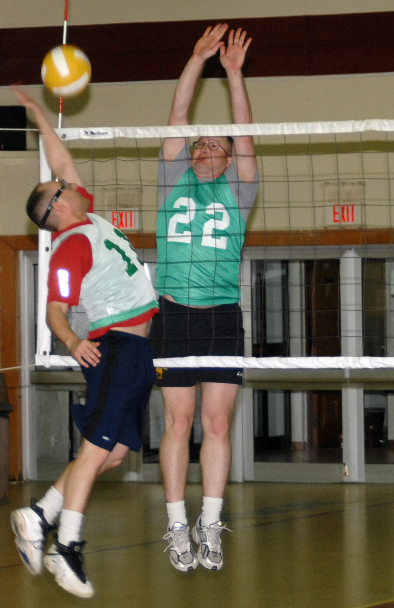 Jeffrey Katzman, 39 ABW volleyball team, attacks the ball while Kristoffer Solesbee, 39 CES volleyball team, prepares to defend. 39 ABW team won the first and third set of the first game, and the first and second set of the second game with the final set score of 25-17.  