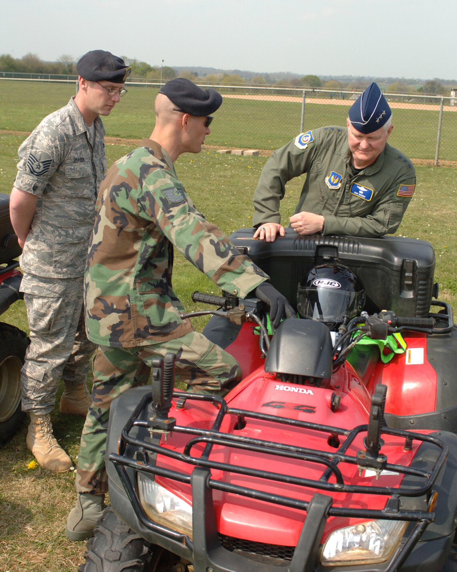 Tech Sgt. Eric Dye, 422nd Security Forces Squadron instructs Lt. Gen. Lt Gen Robert Bishop Jr., Commander 3rd Air Force, and Tech Sgt Kyle Johnson, 422 SFS on proper handling of an all terrain vehicle at RAF Croughton April 22, 2008. 