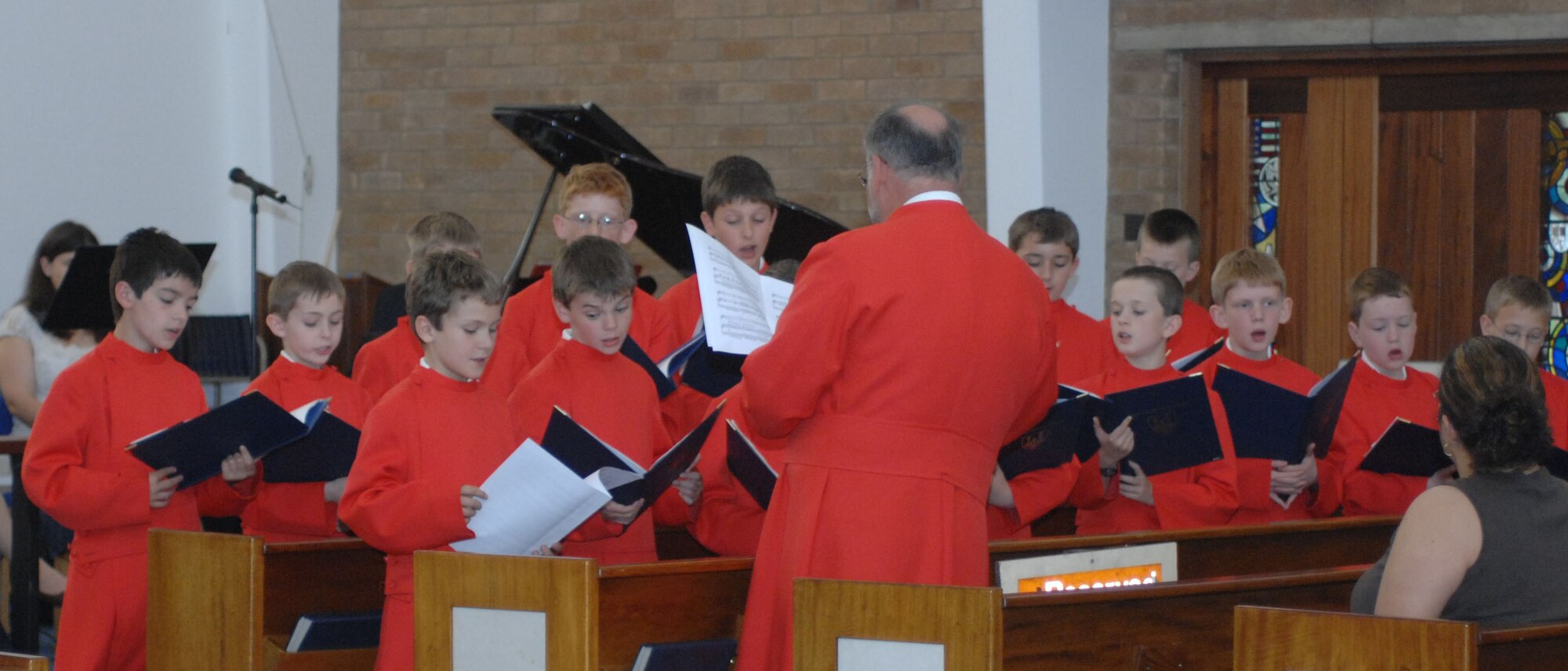 The Ely Cathedral Boys' Choir performs during one of two worship services at the RAF Mildenhall Chapel June 1. Invited by the chapel, the choir performed during the 9:30 a.m. Protestant service and again at the 11 a.m. Catholic Mass. (U.S. Air Force photo by Airman 1st Class Brad Smith) 

