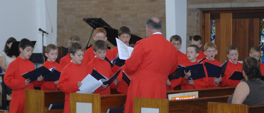 The Ely Cathedral Boys' Choir performs during one of two worship services at the RAF Mildenhall Chapel June 1. Invited by the chapel, the choir performed during the 9:30 a.m. Protestant service and again at the 11 a.m. Catholic Mass. (U.S. Air Force photo by Airman 1st Class Brad Smith) 

