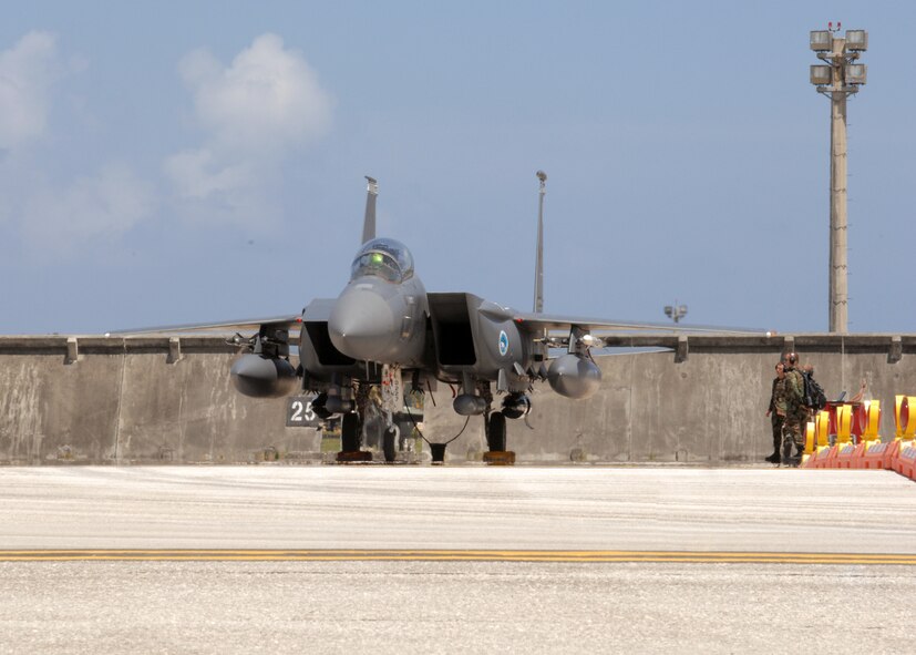 U.S. Air Force F-15E Strike Eagle Crew Chiefs' standby as the  F-15 engines shut down after arriving on the fight line of Andersen Air Force Base, Guam on June 4. The F-15's are from the 389th Fighter Squadron, Mountain Home Air Force Base, Idaho. A total of twelve F-15's are deployed to Andersen for a four month long tour. (U.S. Air Force by Airman 1st Class Nichelle Griffiths) 
