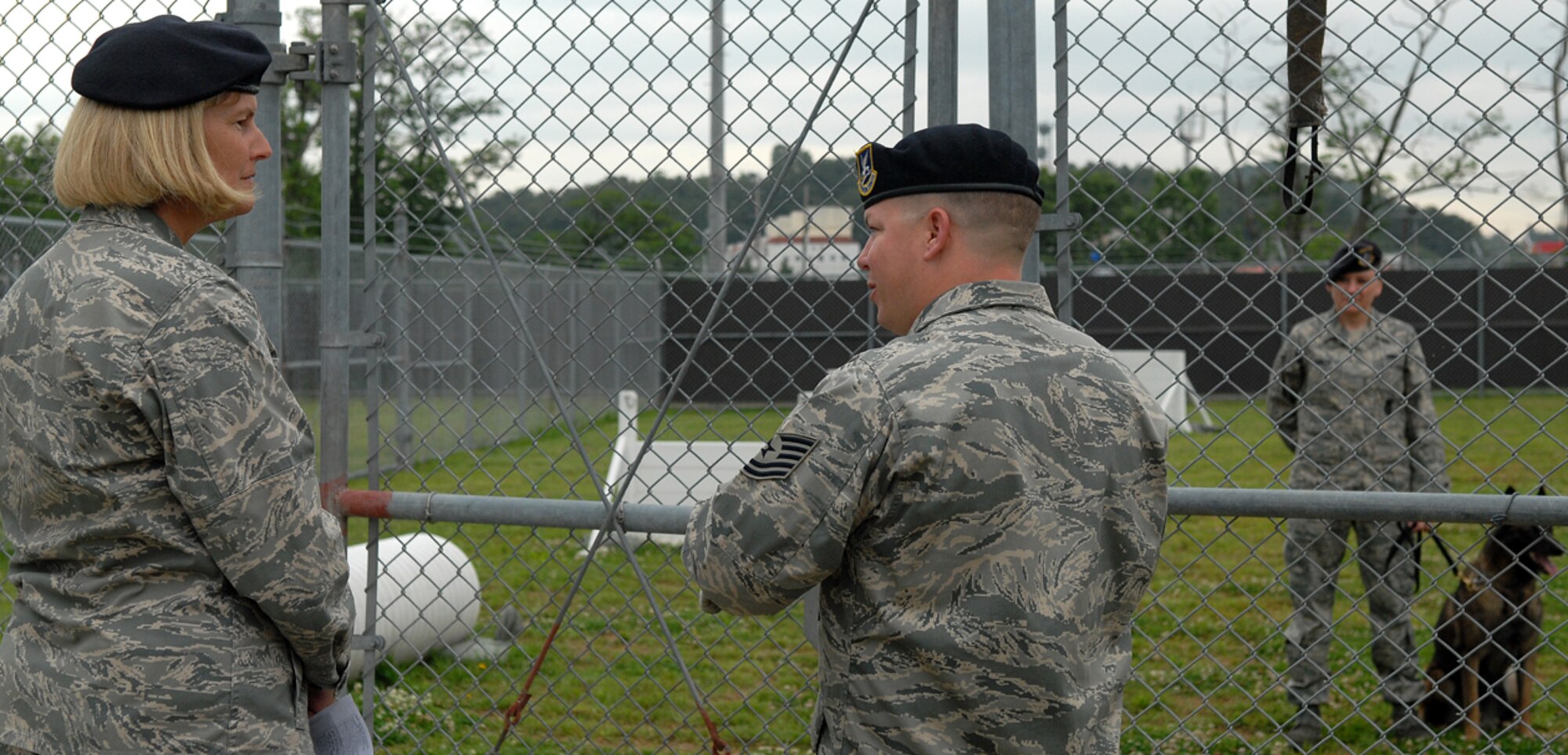 KUNSAN AIR BASE, Republic of Korea -- Technical Sergeant Andrew Odell, 8th Security Forces Squadron force response leader, briefs Brig. Gen. Mary Kay Hertog, Director of Security Forces, about K-9 operations during her visit here June 4. General Hertog visited the Wolf Pack to discuss upcoming changes that directly affect security forces Airmen.  (U.S. Air Force photo/Senior Airman Giang Nguyen)