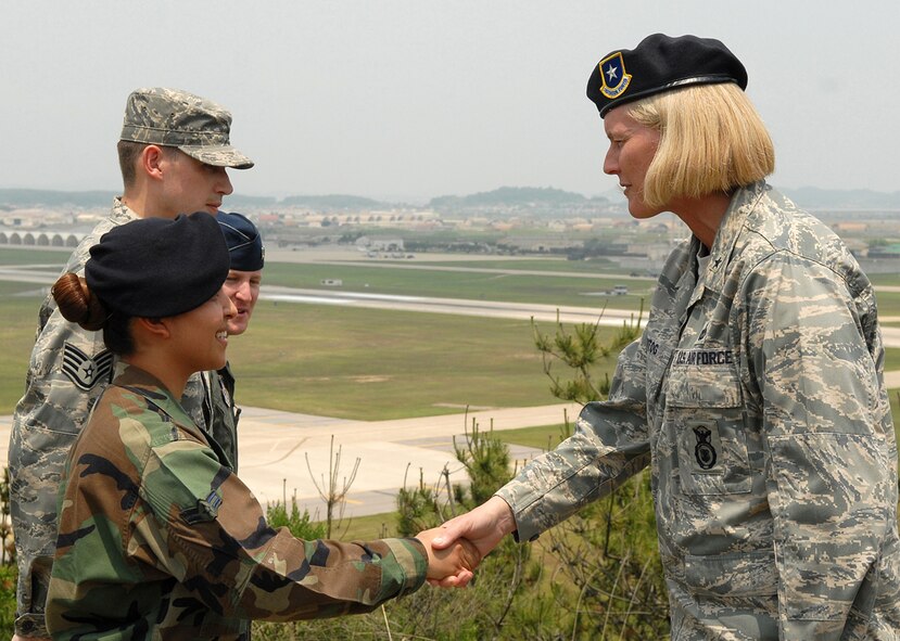 KUNSAN AIR BASE, Republic of Korea -- Brigadier General Mary Kay Hertog, Director of Security Forces, shakes hands with Airman 1st Class Jannete Meireles, 8th Security Forces Squadron force response leader, here June 4. General Hertog visited the Wolf Pack to discuss upcoming changes that directly affect security forces Airmen. (U.S. Air Force photo/Senior Airman Giang Nguyen)